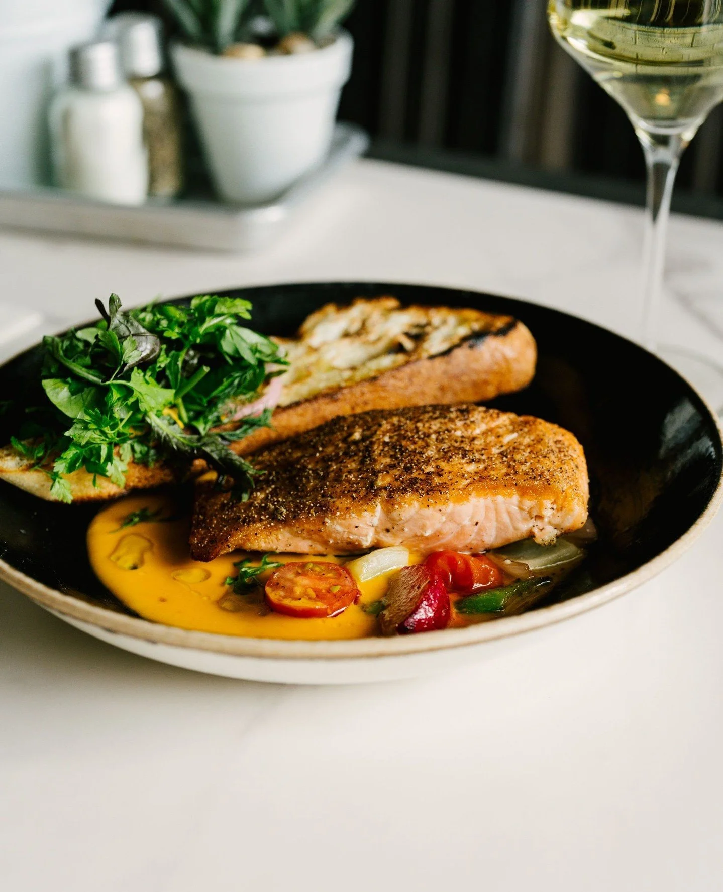 So pretty ya could eat the pictures. 🤩⁠
⁠
A few new summer menu photos for the @thegrocerstable.⁠
⁠
✨️Pan Seared Salmon⁠
saffron tomato beurre blanc, spring vegetables, sourdough crostini⁠
⁠
✨️Grilled Stone Fruit Bruschetta⁠
house ricotta, burnt hon