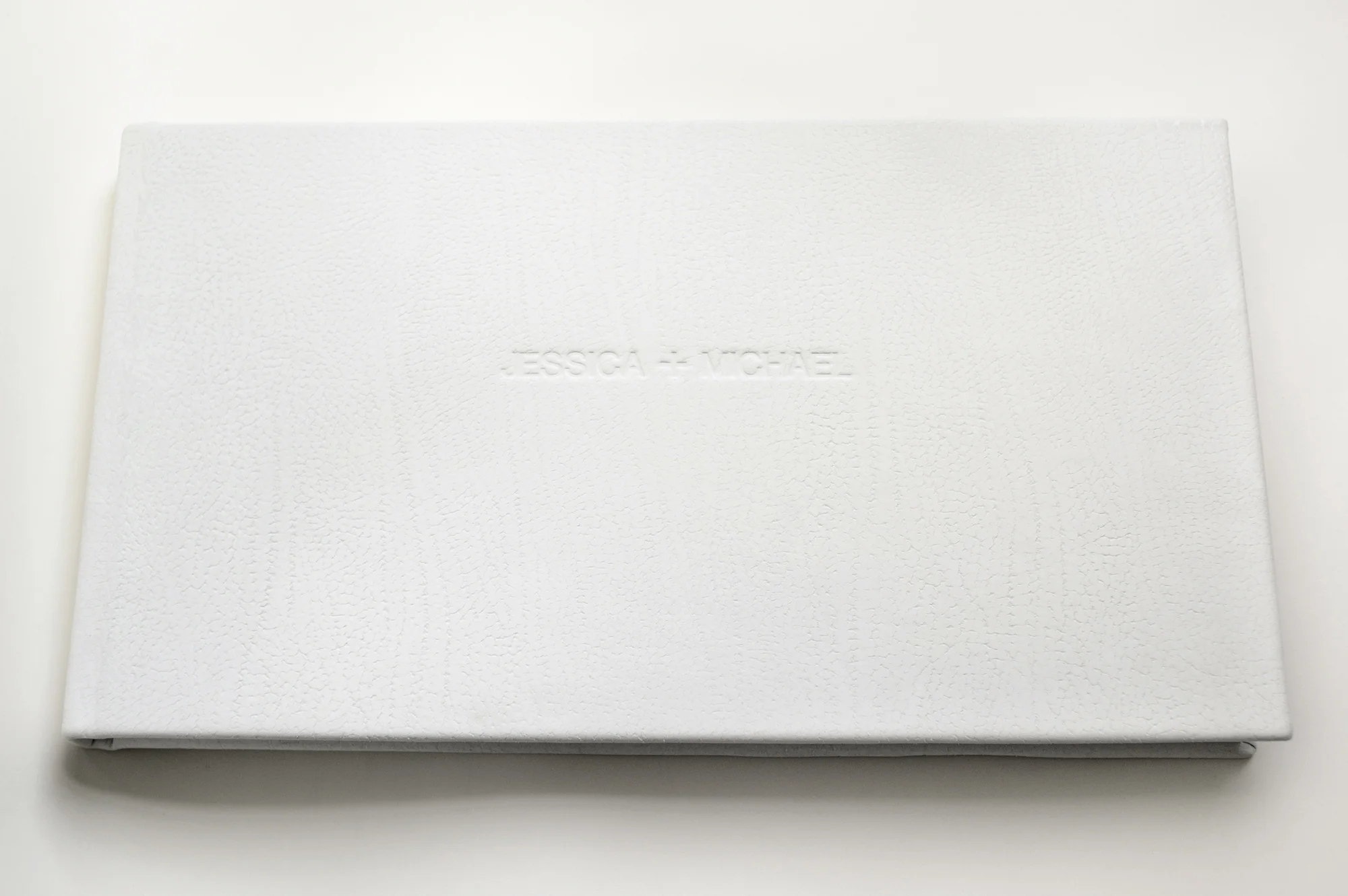 Jessica + Michael 18" x 10" panoramic, Duo Ivory contemporary leather, embossed cover