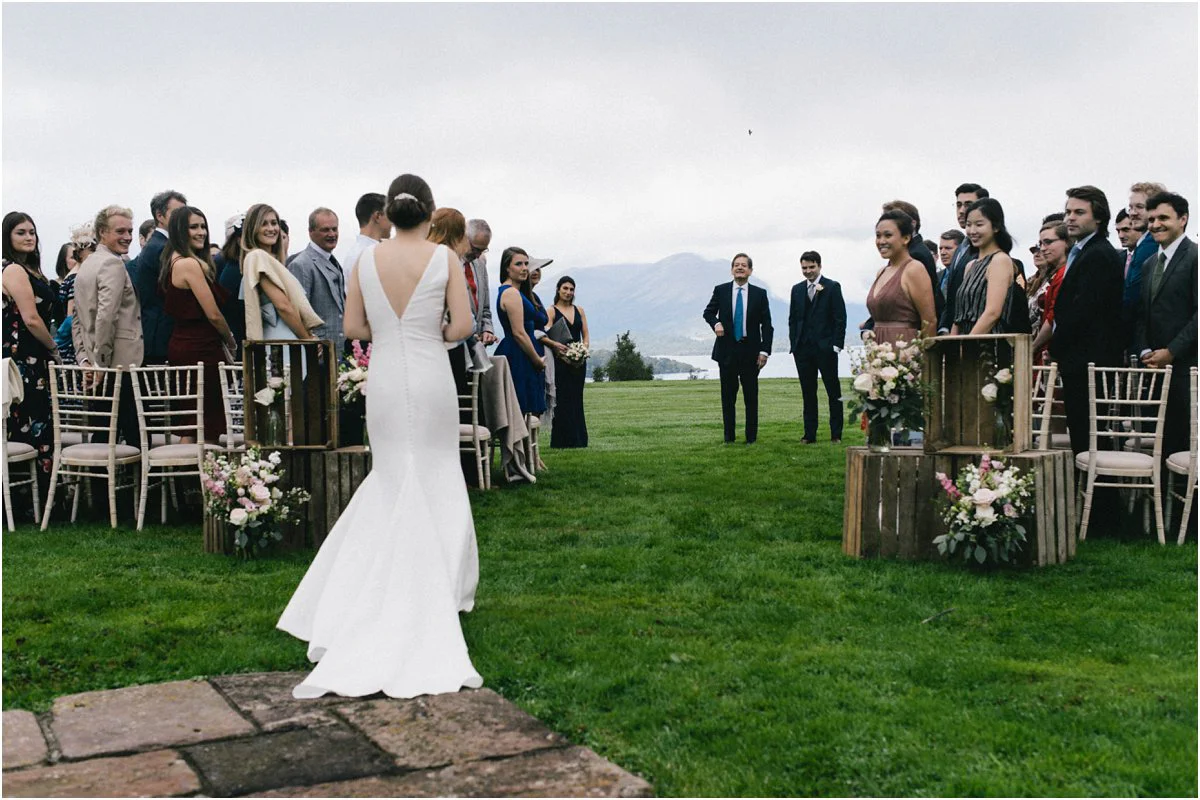 Bride walking down the aisle for her wedding ceremony at Ardoch House Scotland