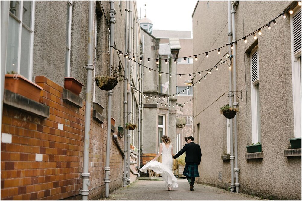  Summerhall wedding of Hannah & Sean in Edinburgh - couple walking to the courtyard 