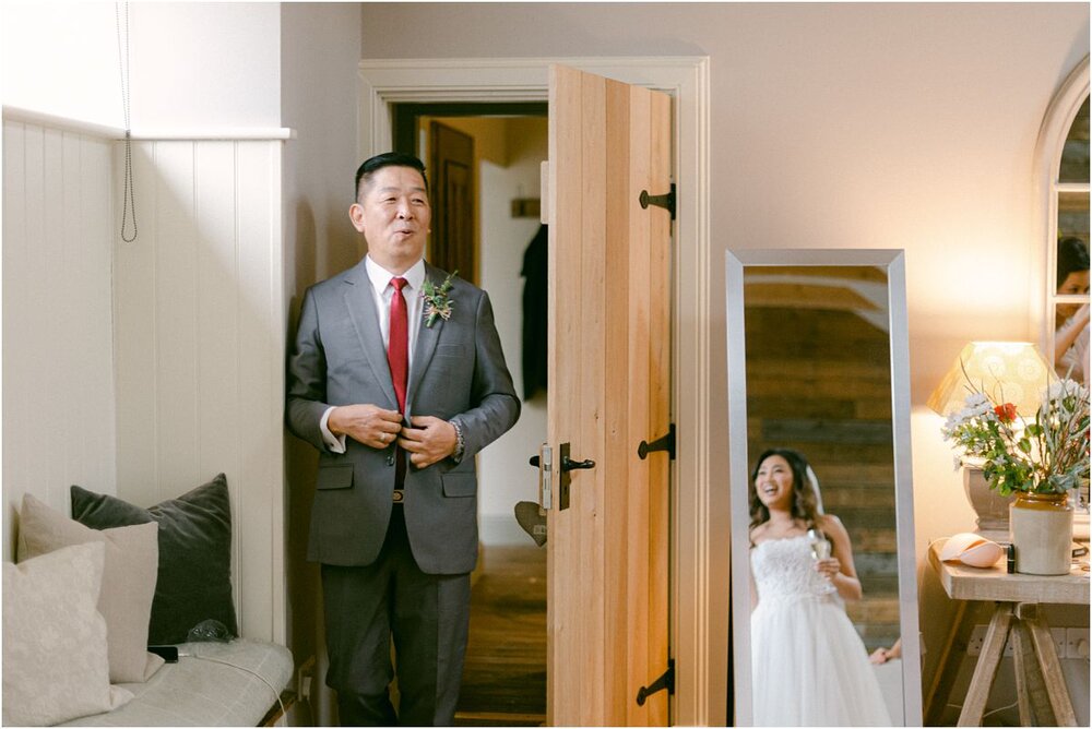  A father of the bride mmets her before the ceremony at The Byre At Inchyra in Perthshire in Scotland by Crofts & Kowalczyk Photography 