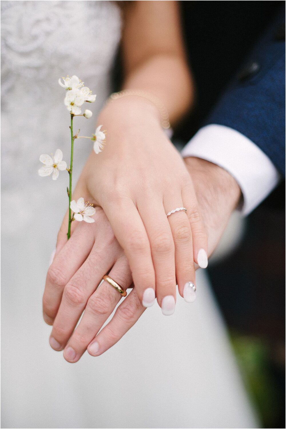  Wedding rings and cherry blossom at The Byre At Inchyra in Perthshire in Scotland by Crofts & Kowalczyk Photography 