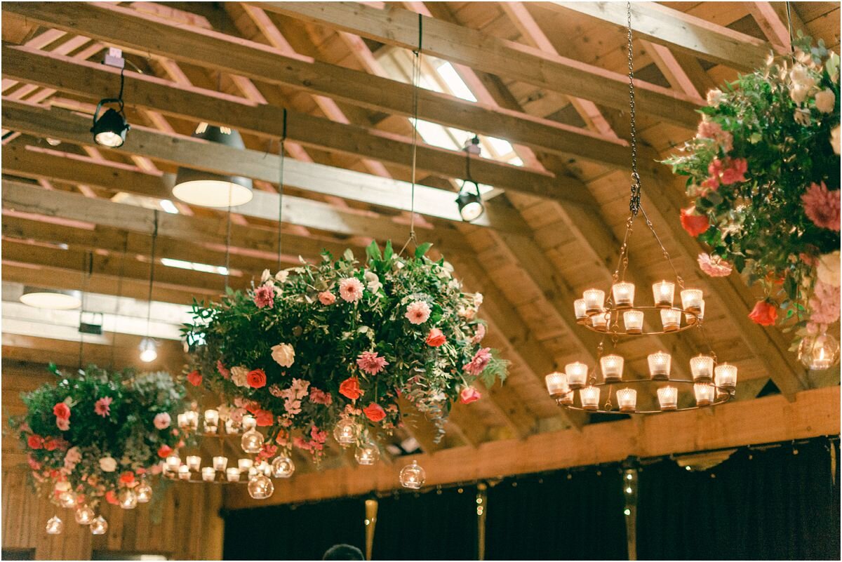  Hanging flower decorations at a wedding at The Byre At Inchyra in Perthshire in Scotland by Crofts & Kowalczyk Photography 