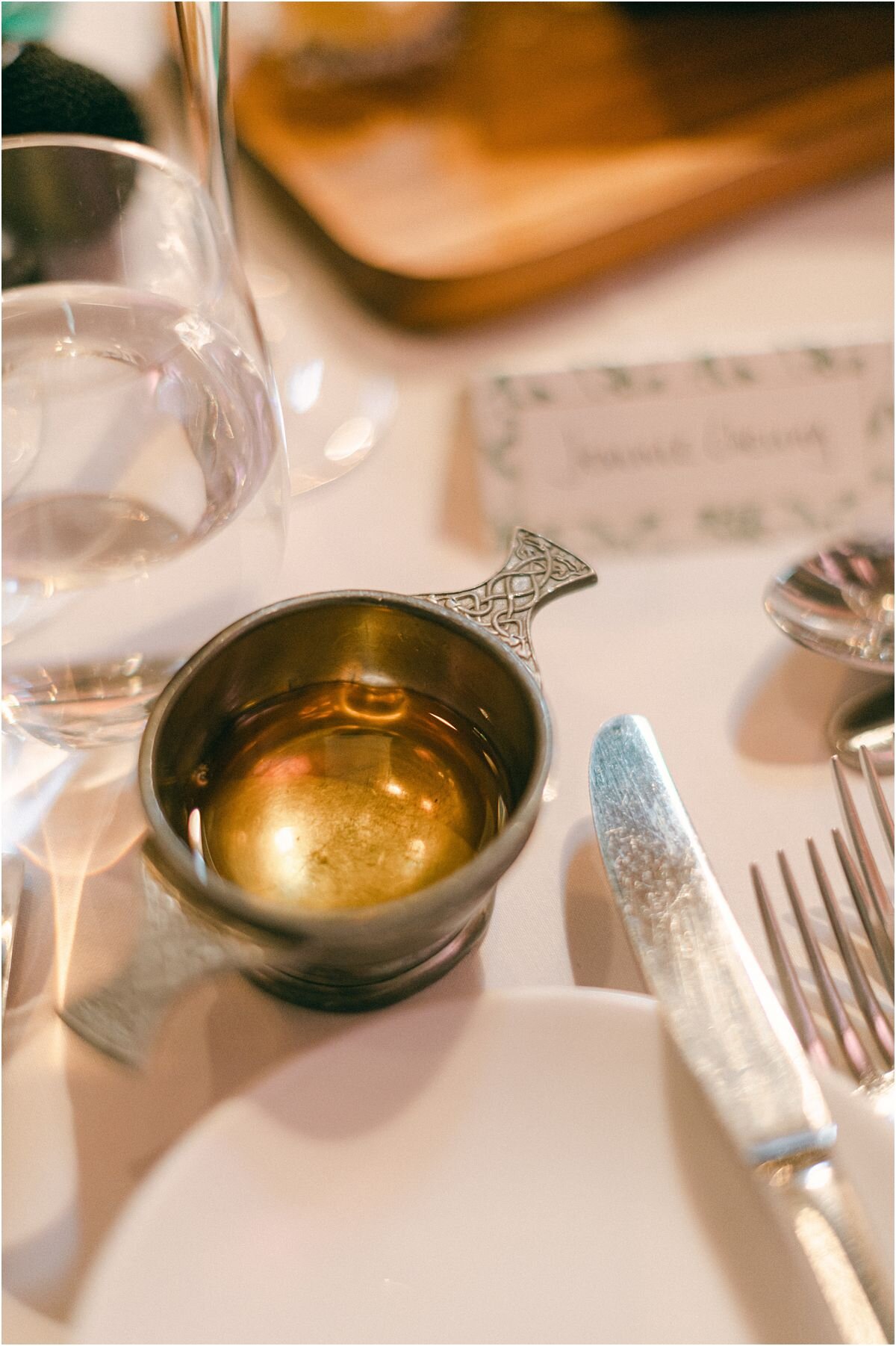  A quaich on a table at a wedding at The Byre At Inchyra in Perthshire in Scotland by Crofts & Kowalczyk Photography 