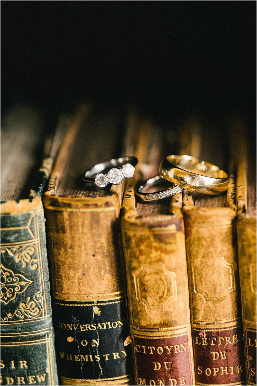  A still life with wedding rings and old books at a library at Winton Castle Scotland 