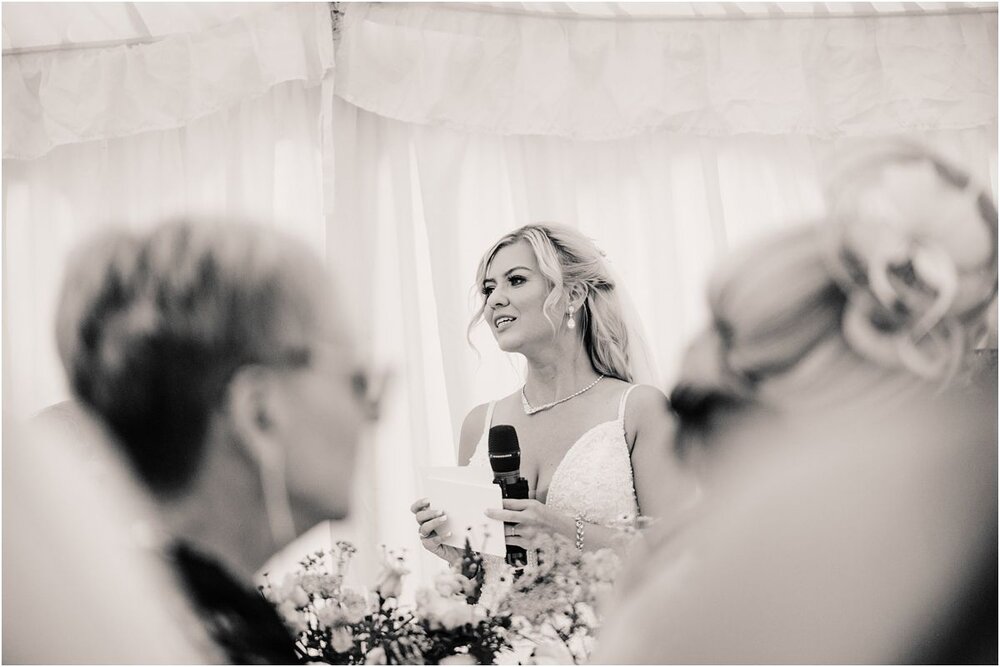  A bride giving a speech at a Summer wedding at Winton castle Scotland  