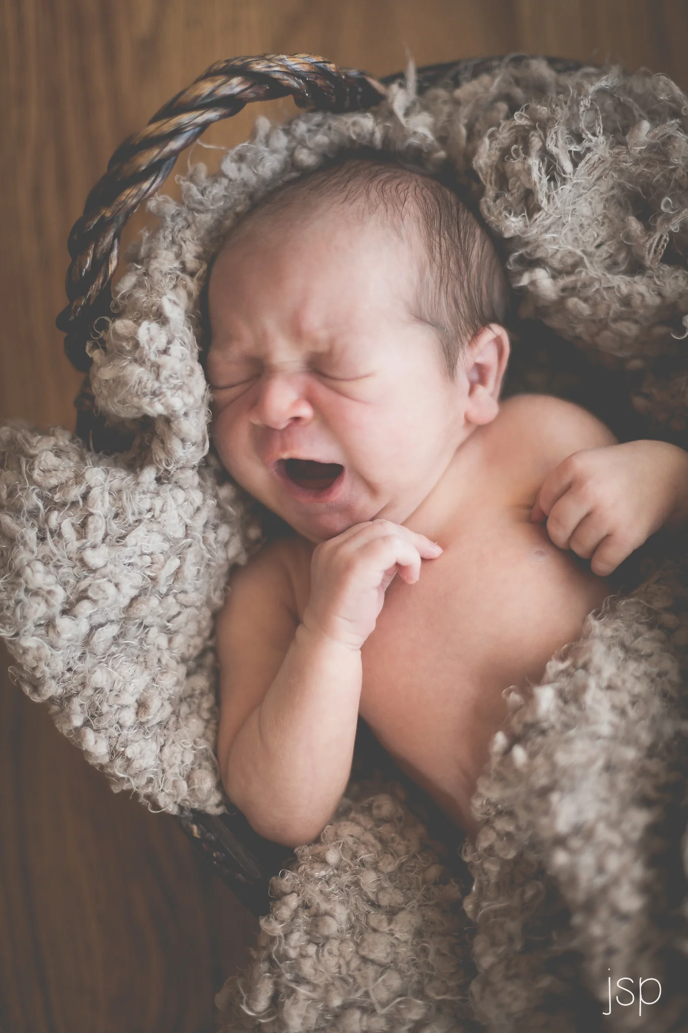 Newborn Yawning in Basket