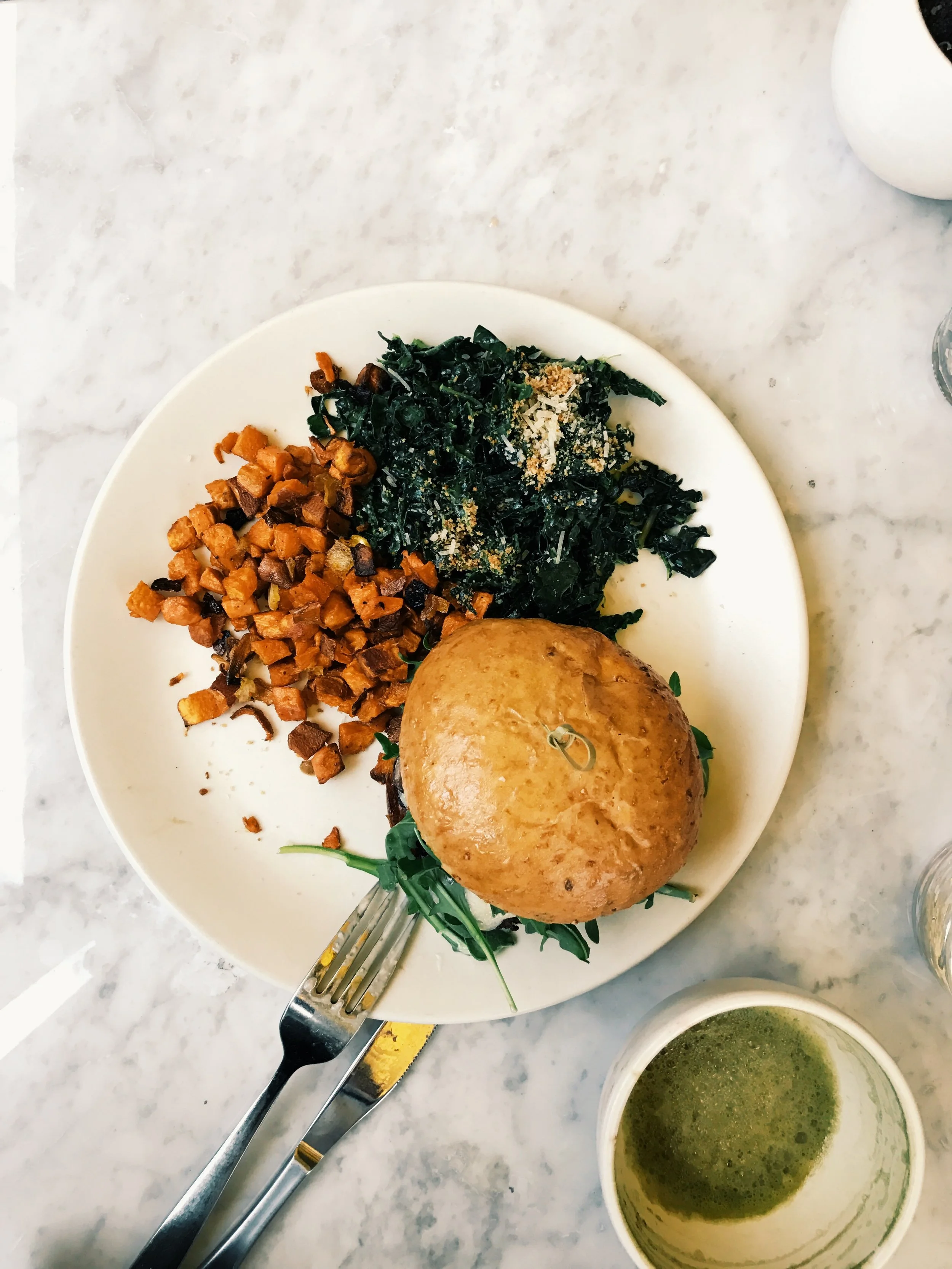 Grass-Fed Burger with umami mushroom, caramelized onion, arugula, parmesan, mayonnaise, flax seed bun. SO GOOD!