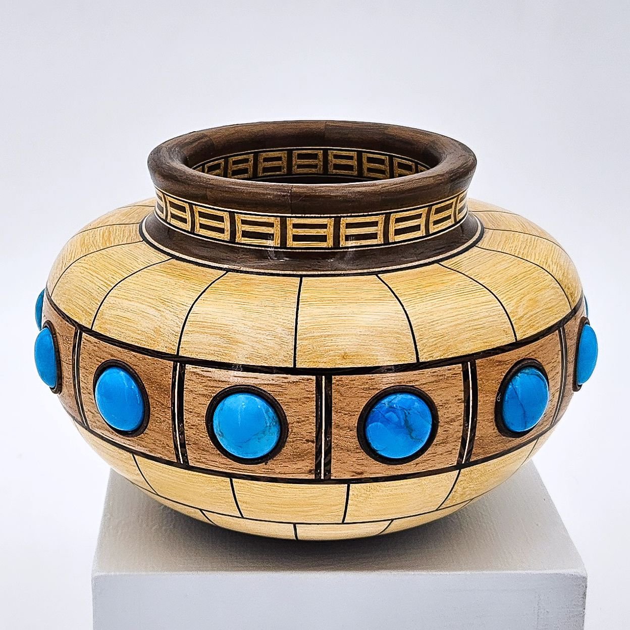 The Lil Vessel Series. A small segmented vessel made from Goiabao (Kimboto), Pecan, Wenge, Black Walnut, and Turquoise. Approximately 5.75&quot; x 4&quot;. More: See links in bio.
:
:
:
#woodart, #finewoodart, #sculpture, #woodsculpture, #woodturning