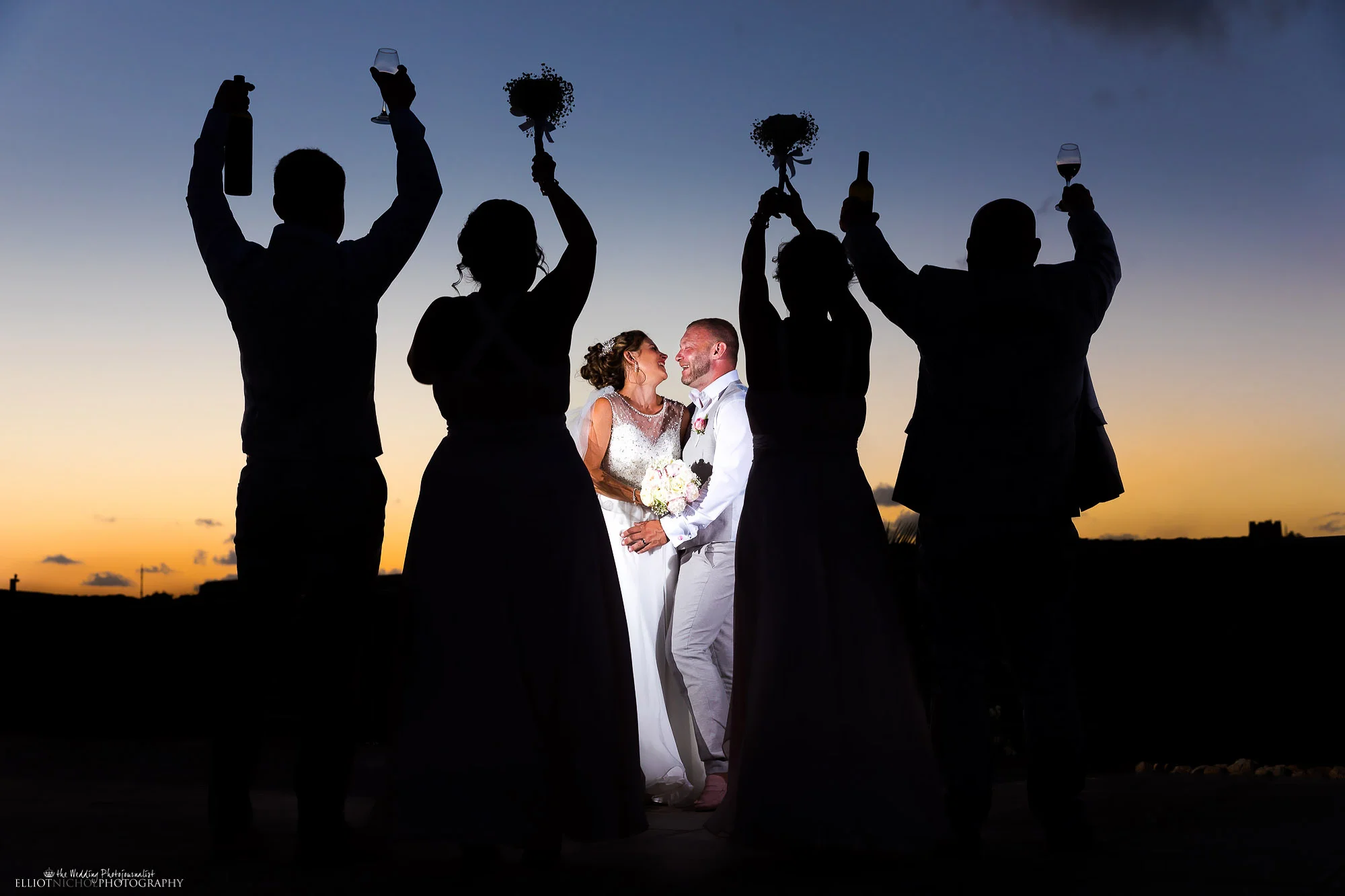 Creative wedding day portrait of the bride and groom with some of their wedding party. Photo by Newcastle based Elliot Nichol photography.