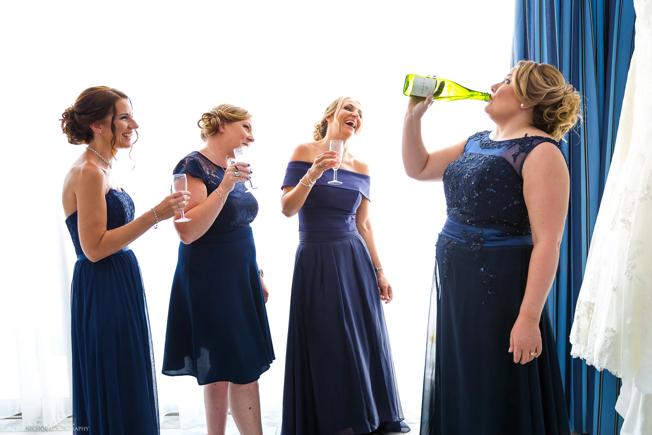 Bridesmaids have a little bit of dutch courage before leaving for the ceremony. Photo by Elliot Nichol Photography.