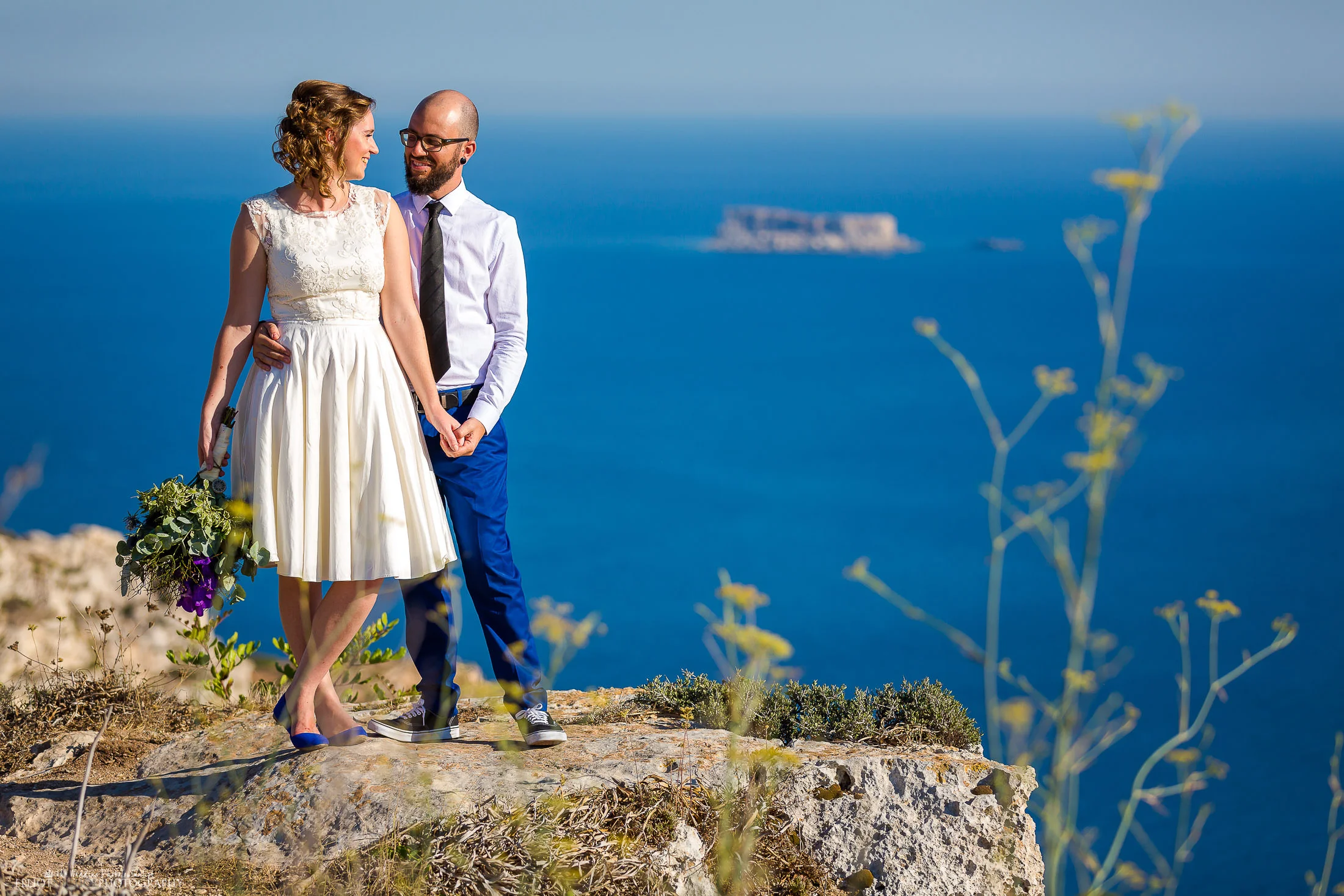 Cliff edge wedding. Bride and groom take some time out. Photo by Elliot Nichol Photography.