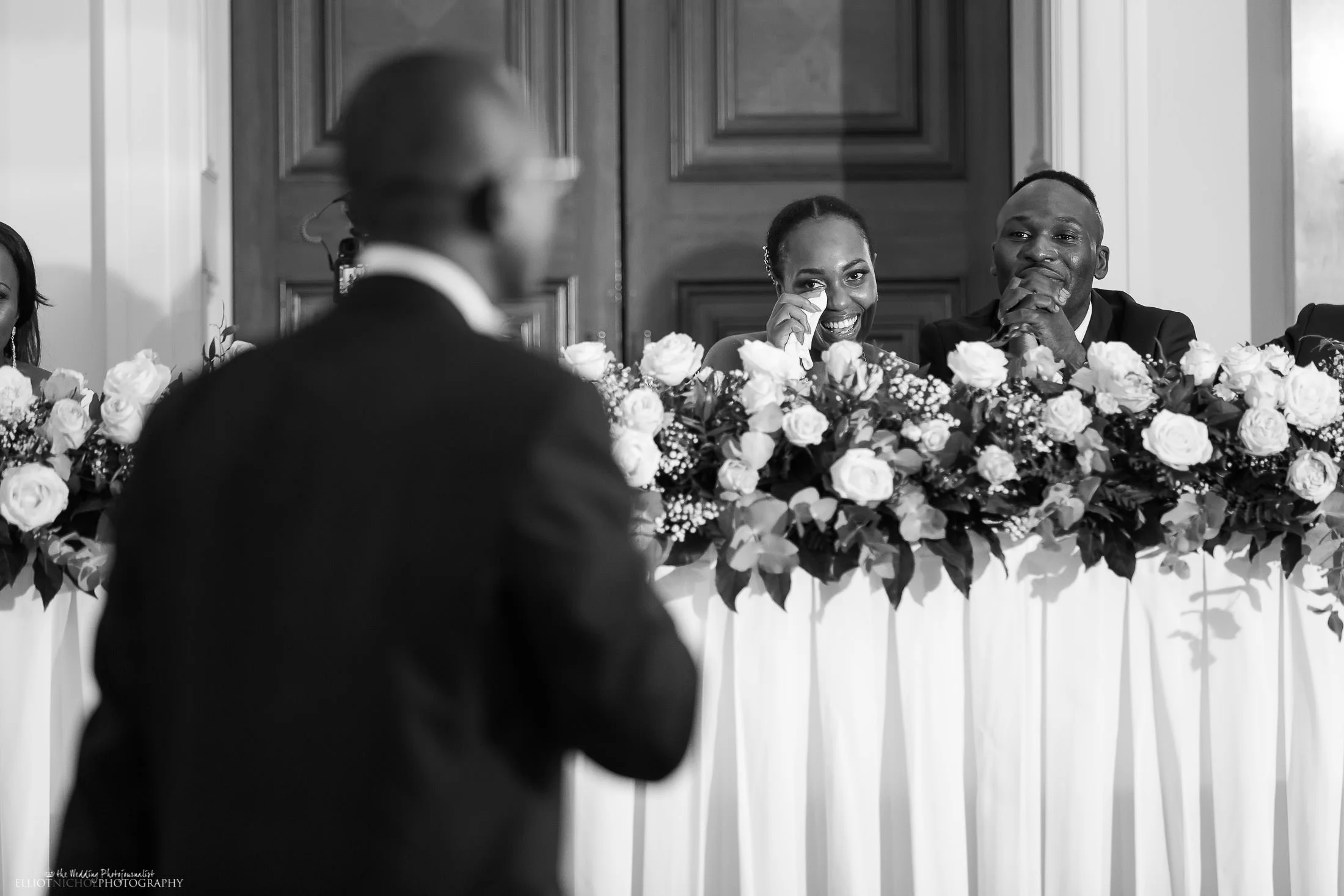 Bride bought to tears during her fathers wedding reception speech. Photo by Wedding Photojournalist Elliot Nichol.