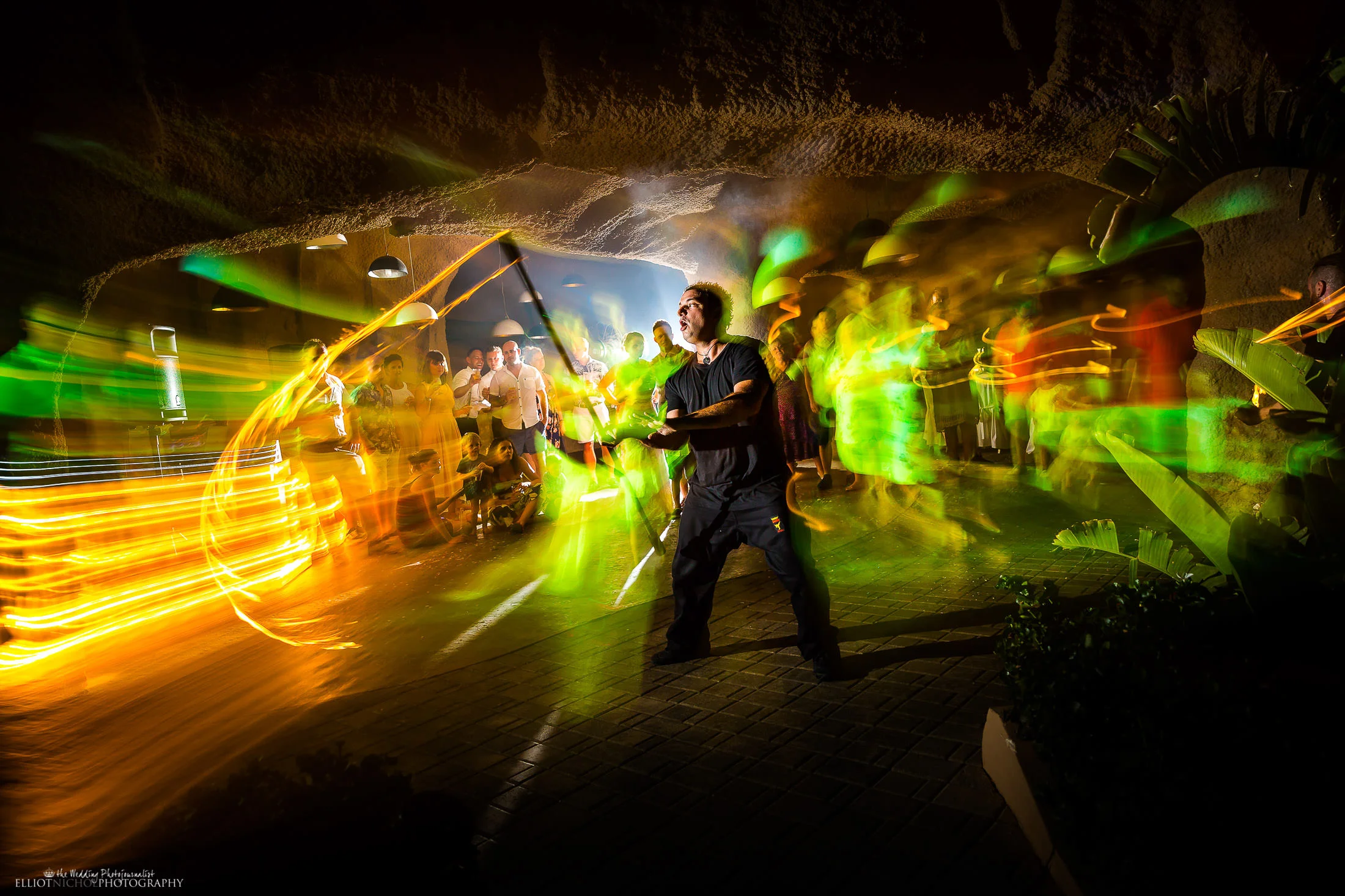 Fire dancer performs at wedding reception. Photo by Elliot Nichol Photography.