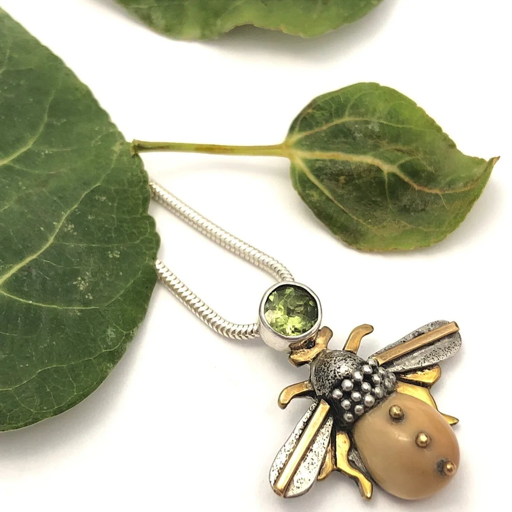 Fossil Ivory Bee and Peridot Pendant — The Jewel