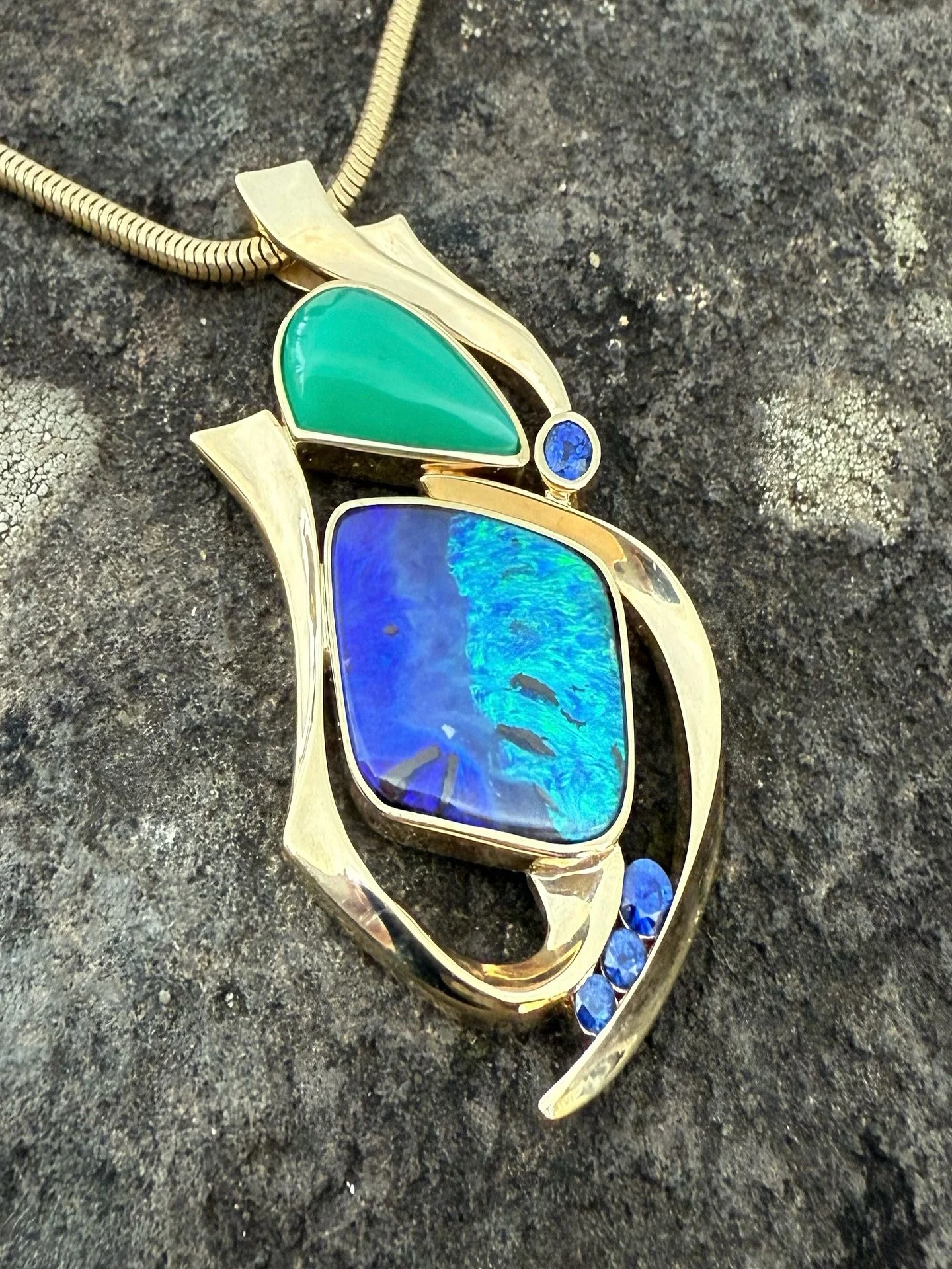 A gorgeous newly finished piece, with chrysoprase, sapphire, and an Australian opal set in 14kt gold. Just in time for an October birthday! Call the gallery for more details, coming up on the website soon. #jandaggett #thejewel #sistersoregon #sister