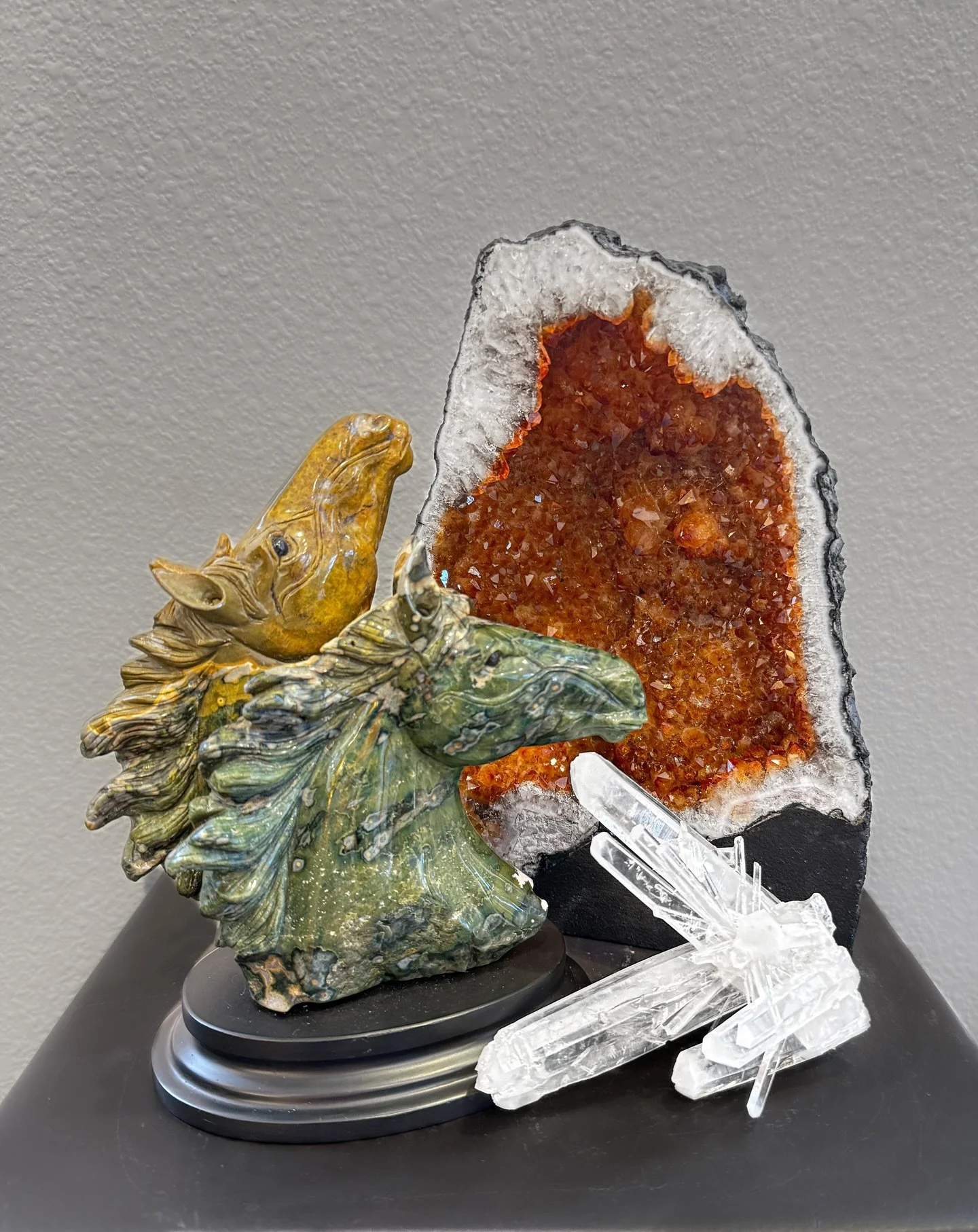 Another glimpse of the minerals and home decor we have collected for the gallery! Brazilian citrine, Colombian quartz, and a dual horse head sculpture carved from a single piece of ocean jasper out of Madagascar. #minerals #stonecarving #quartz #citr