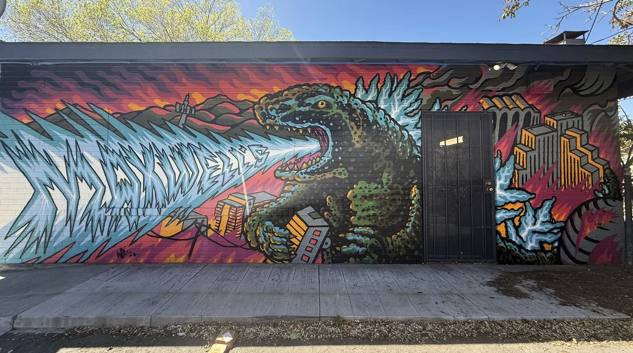  Godzilla mural in Reno, Nevada painted by Nathaniel Benjamin, a reno artist, printmaker, muralist, making street art and murals. 