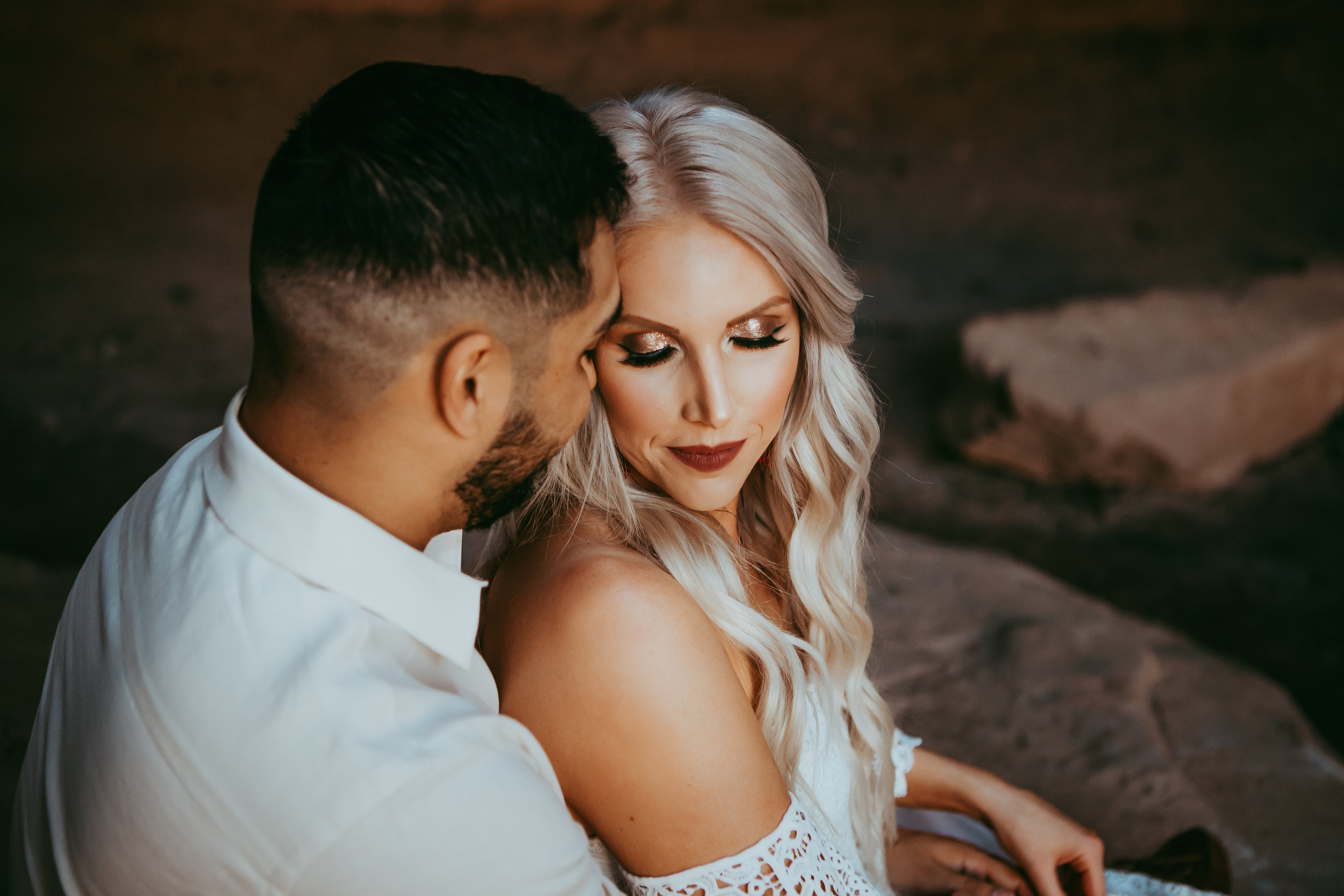 Off the shoulder white top in casual clothing in front of red sandstone #engagementphotos #riverfalls #engaged #personality #amarillotexas #engagementphotographer #lifestylephotos #amarillophotographer #locationchoice #texasengagementphotos #engagment #tealawardphotography #wildliferefuge