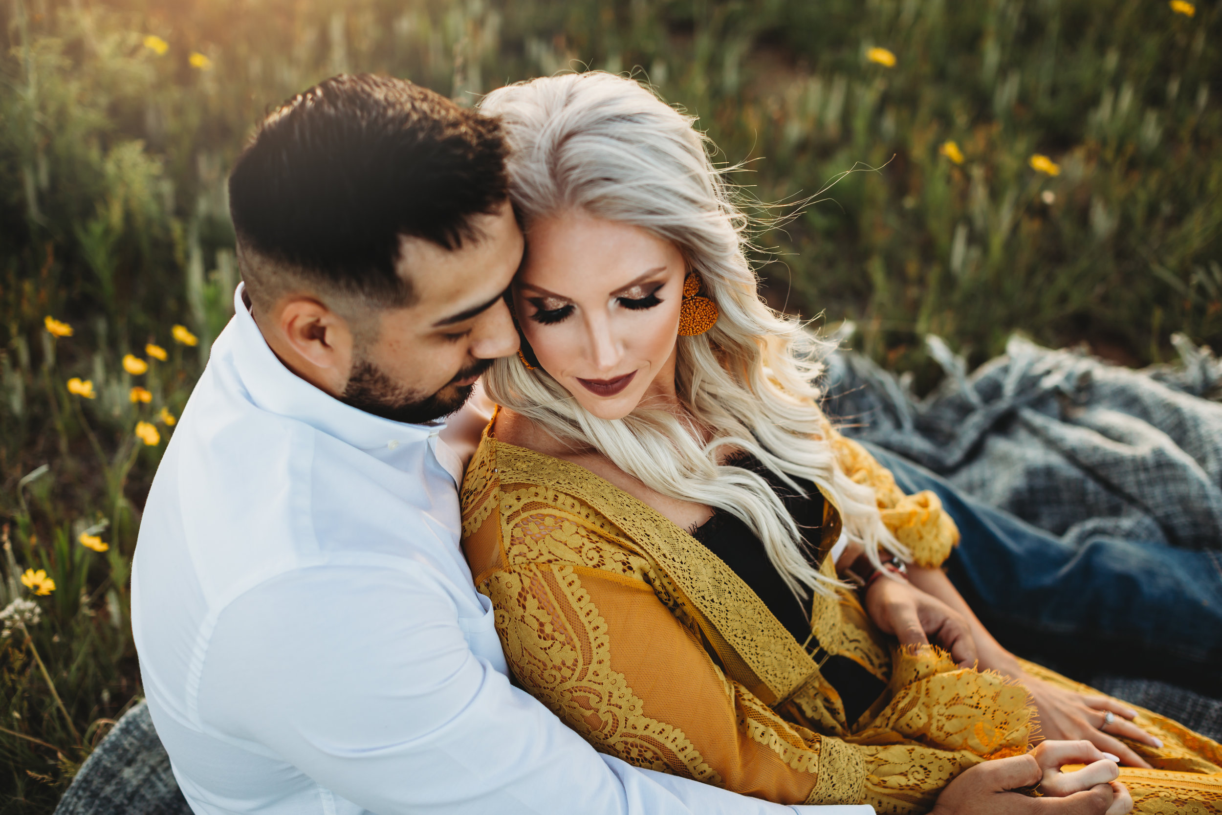 Splash of yellow color added as couple sits on the ground holding each other #engagementphotos #riverfalls #engaged #personality #amarillotexas #engagementphotographer #lifestylephotos #amarillophotographer #locationchoice #texasengagementphotos #engagment #tealawardphotography #wildliferefuge