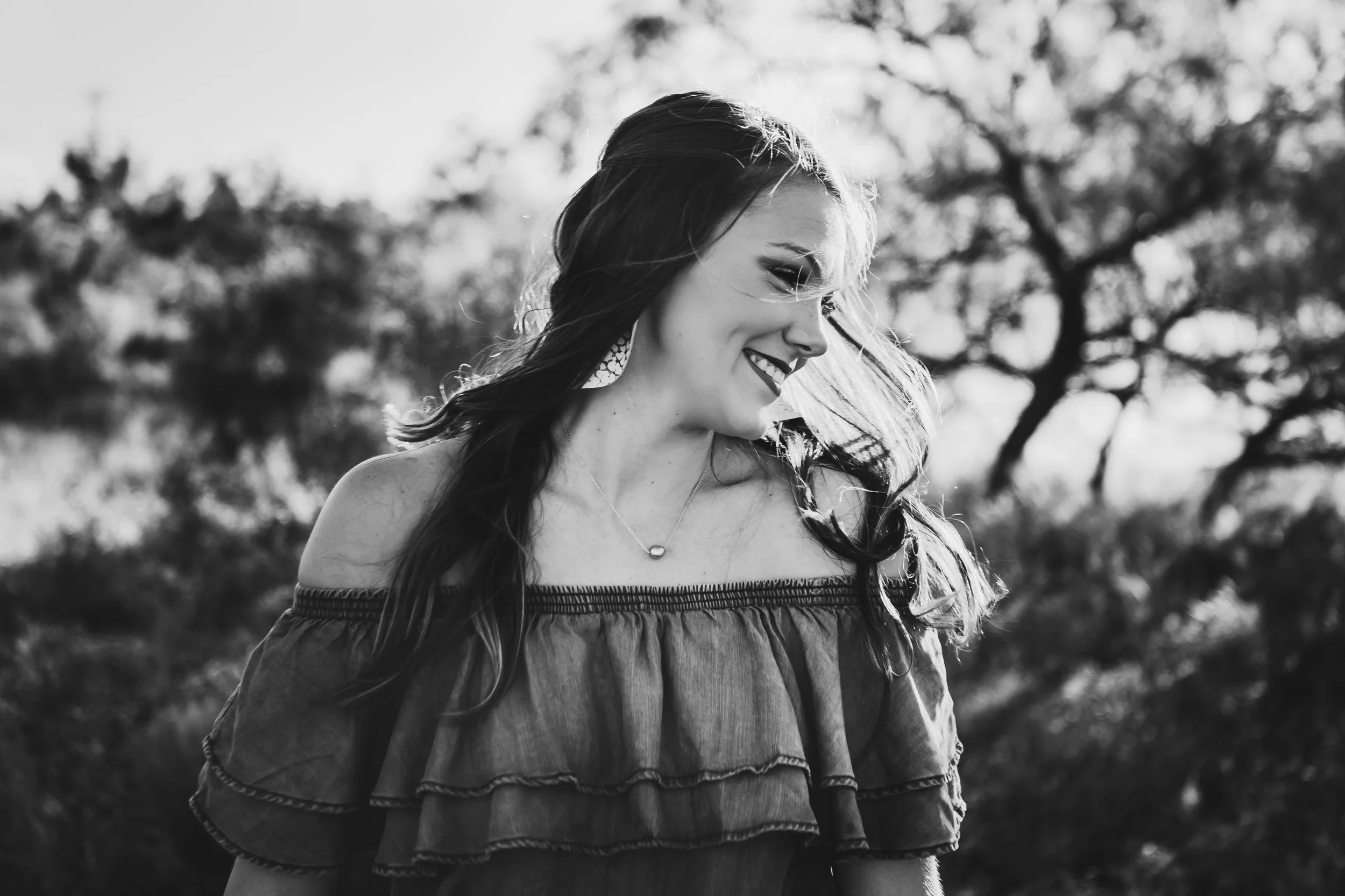 Black and white photo of oldest daughter smiling with a side profile #tealawardphotography #texasfamilyphotographer #amarillophotographer #amarillofamilyphotographer #lifestylephotography #emotionalphotography #familyphotosoot #family #lovingsiblings #purejoy #familyphotos #familyphotographer #greatoutdoors