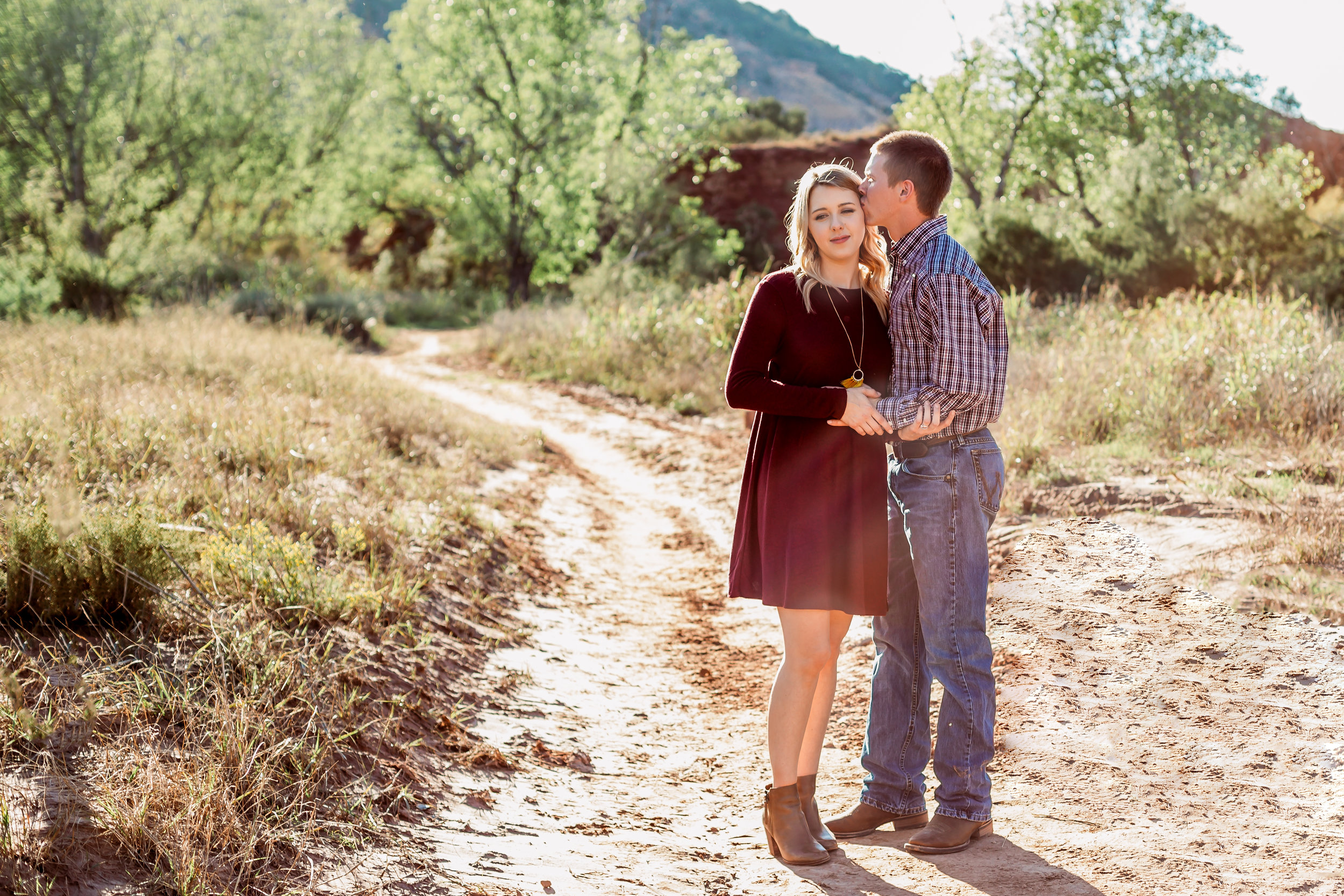 Mom and dad share a kiss on the cheek on the pathway for this family session #tealawardphotography #texasfamilyphotographer #amarillophotographer #amarillofamilyphotographer #lifestylephotography #emotionalphotography #familyphotosoot #family #lovingsiblings #purejoy #familyphotos #familyphotographer #greatoutdoors