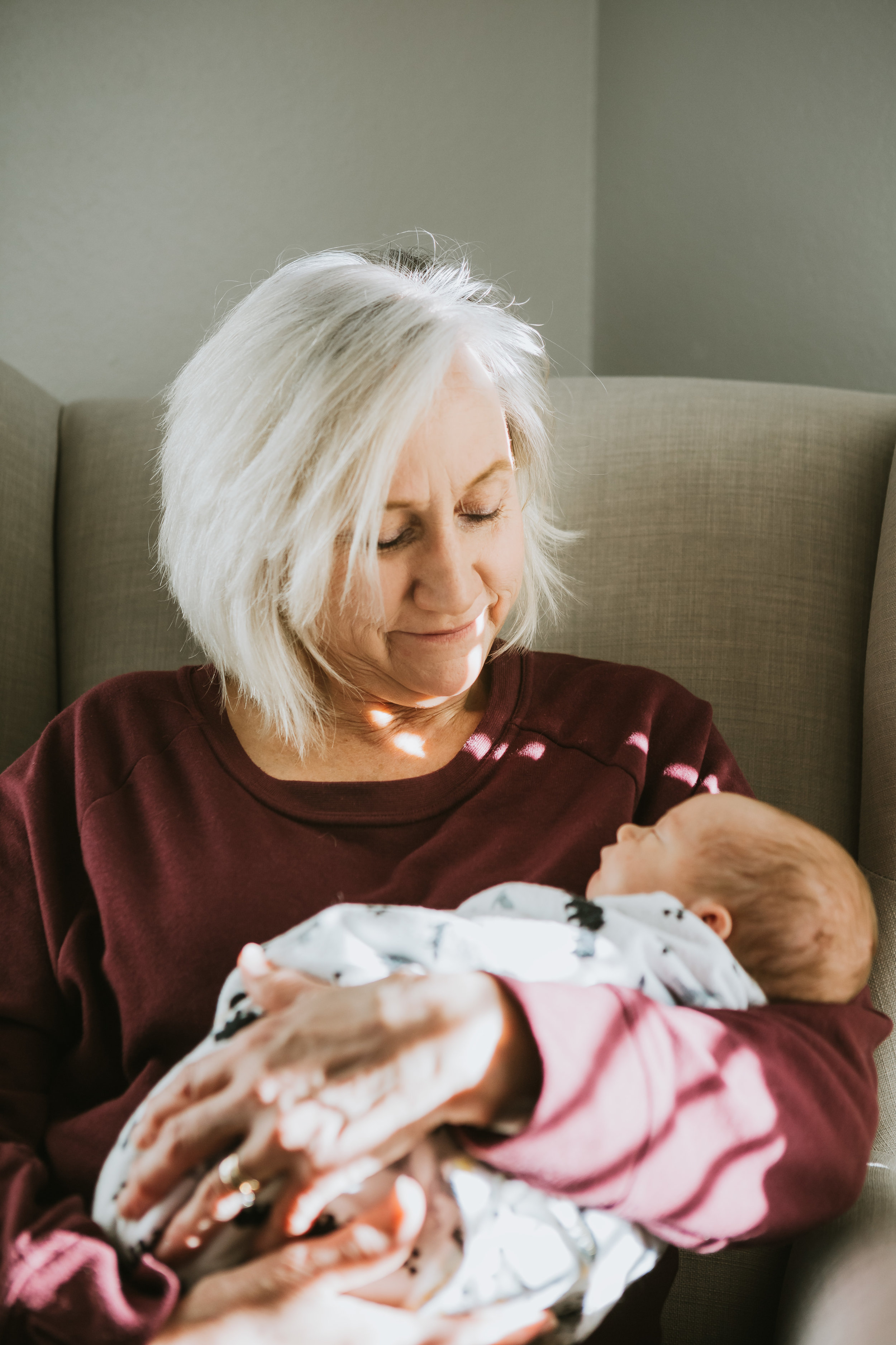  Grandma holding newborn baby in rocking chair #tealawardphotography #texasnewbornphotographysession #amarillophotographer #amarilloenewbornphotographer #emotionalphotography #lifestylephotography #inhomesession #lifestyles #newbaby #newfamilyofthree #sweetbaby #nurseryphotos 