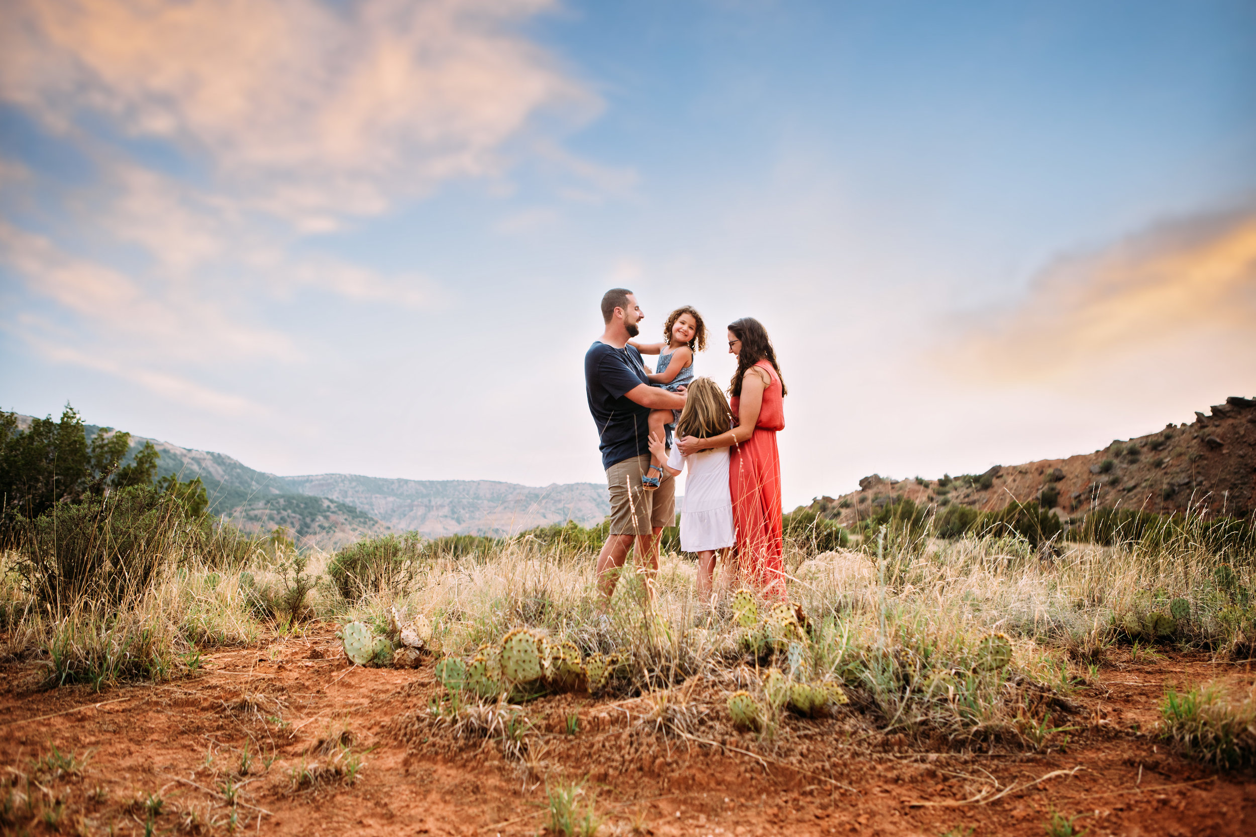 Summer photography session with family in front of red rocks and natural landscape #tealawardphotography #texassummerphotographer #pictureseason #amarillophotographer #amarillofamilyphotographer #emotionalphotography #engagementphotography #couplesphotography #pickingaseasonforphotosessions #whatsimportant #everythingtogether #pickingcolorsforphotos #summerphotos #greeneryinphotos