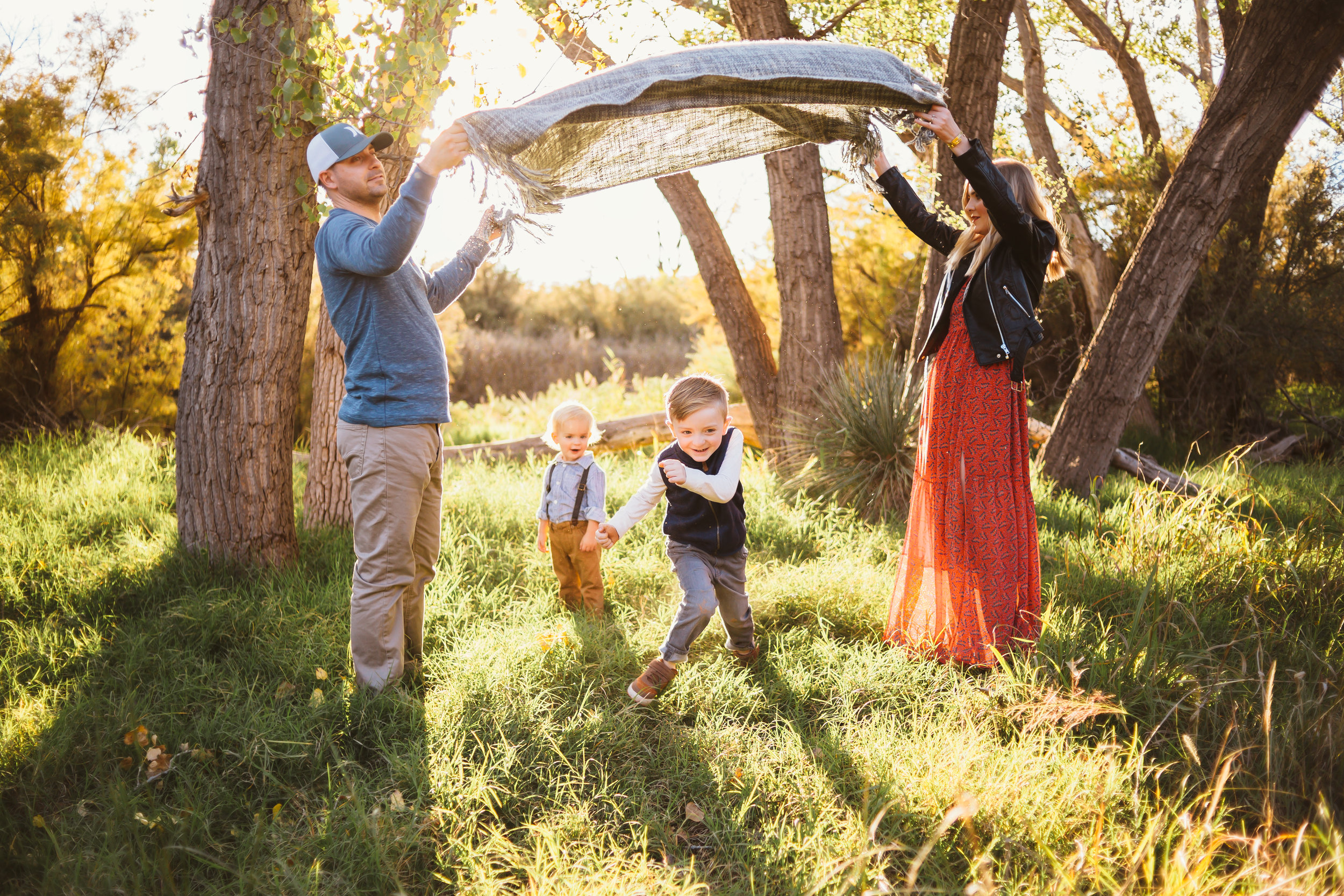 Fun and games is important as mom and dad play with their kids during family photo session #tealawardphotography #texasfamilyphotographer #amarillophotographer #amarillofamilyphotographer #lifestylephotography #emotionalphotography #familyphotosoot #family #lovingsiblings #purejoy #familyphotos #familyphotographer #greatoutdoors #unposed #naturalfamilyinteraction