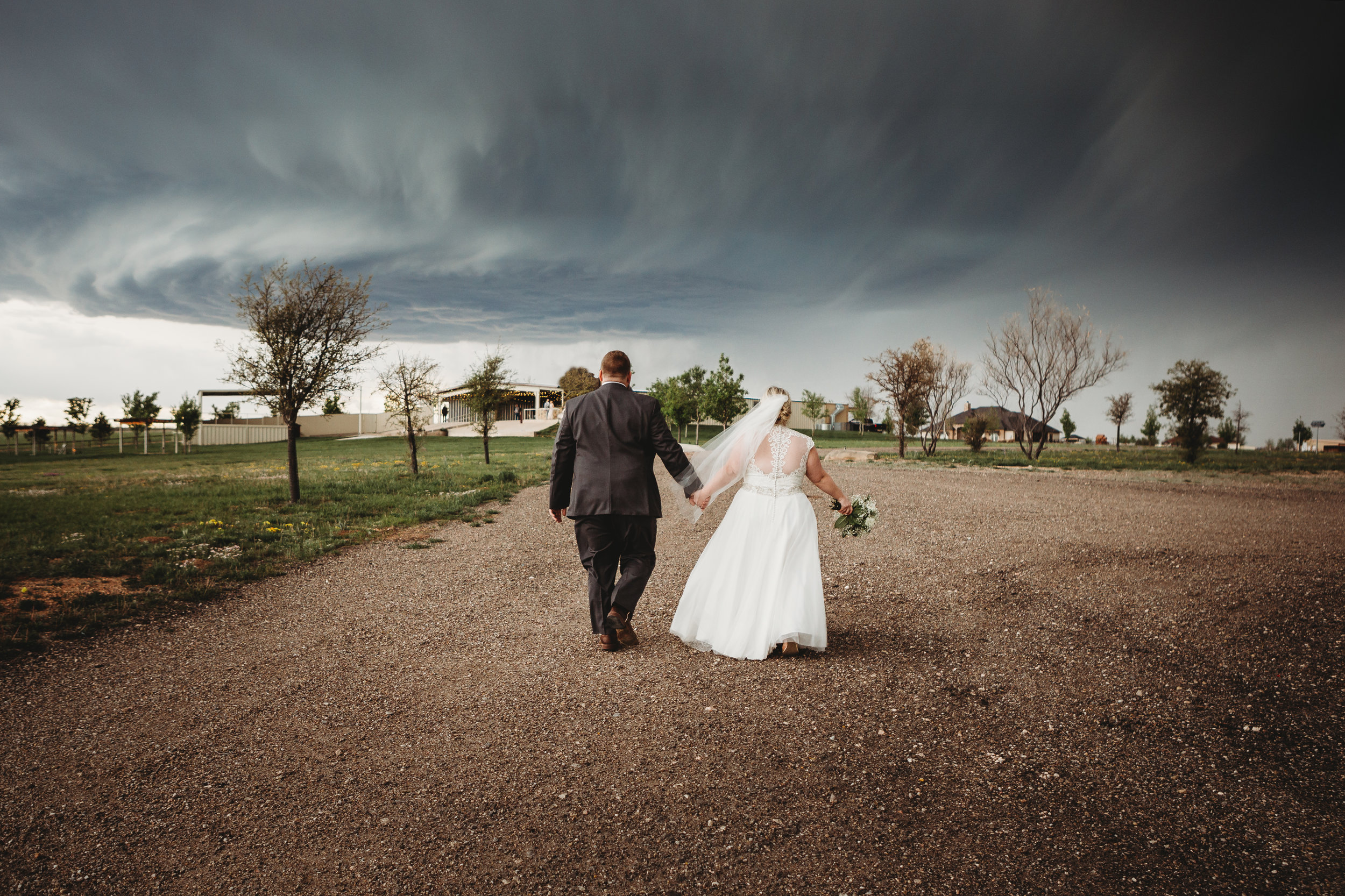  Storms on the horizon but keeping at bay during wedding portrait session with bride and groom #tealawardphotography #texasweddings #amarillophotographer #amarilloweddingphotographer #emotionalphotography #intimateweddingphotography #weddingday #weddingphotos #texasphotographer #inspiredwedding #intimatewedding #weddingformals #bigday #portraits 