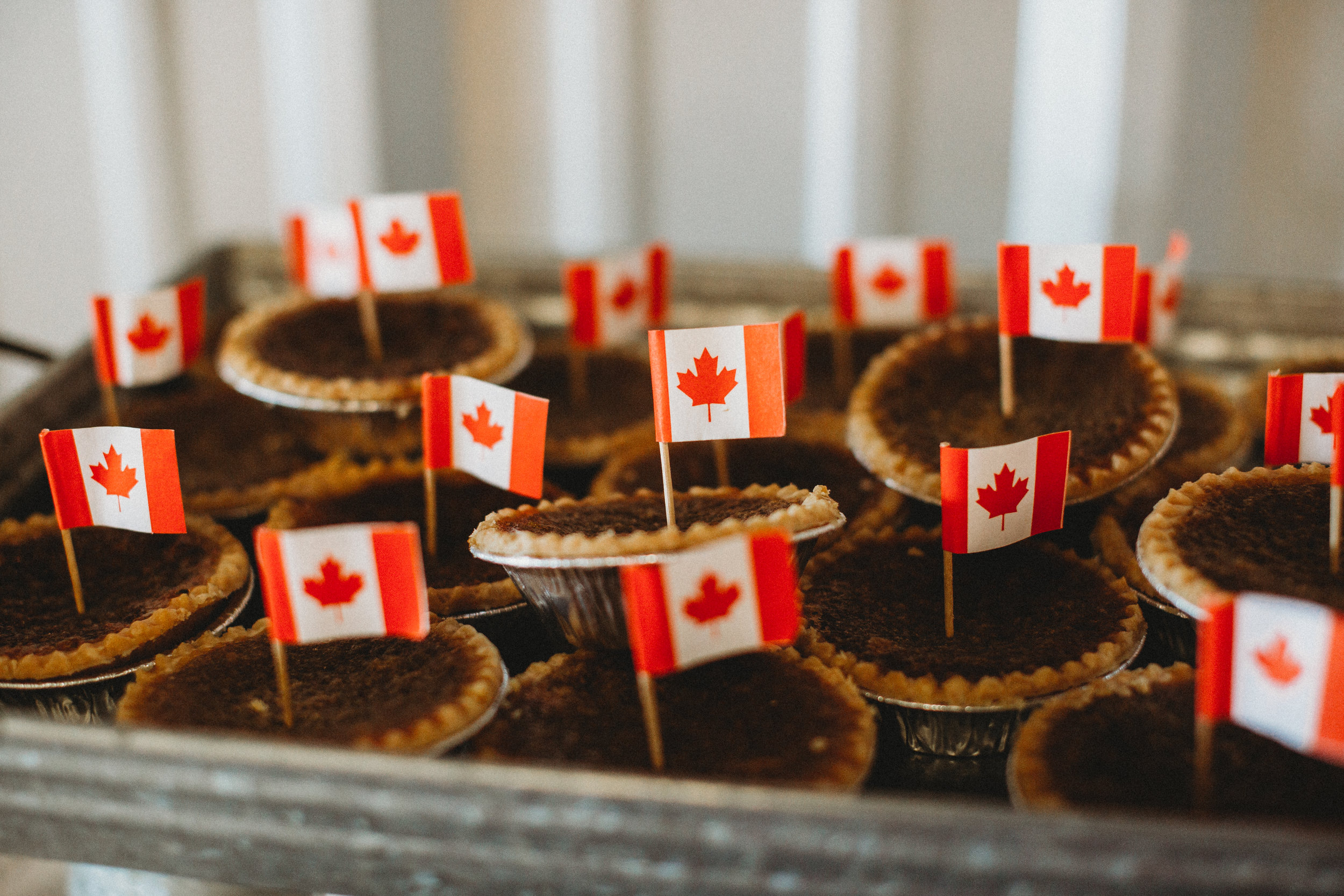 Delicious pies with Canadian flags representing the brides hometown in Canada #tealawardphotography #texasweddings #amarillophotographer #amarilloweddingphotographer #emotionalphotography #intimateweddingphotography #weddingday #weddingphotos #texasphotographer #inspiredwedding #intimatewedding #weddingformals #bigday #portraits 