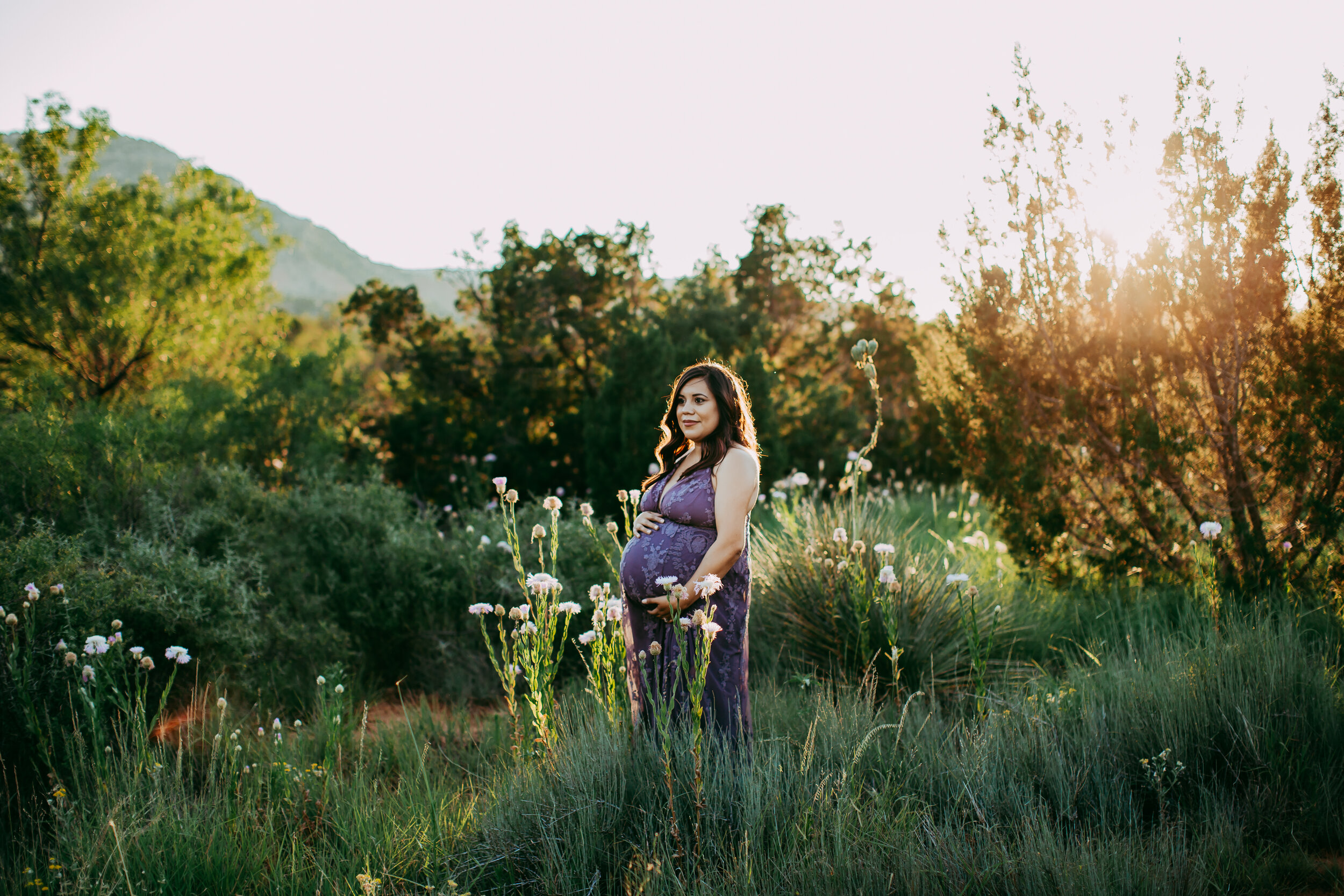 Gorgeous green foliage around mom to be wearing rich purple dress #tealawardphotography #texasmaternityphotographysession #amarillophotographer #amarilloematernityphotographer #emotionalphotography #lifestylephotography #babyontheway #lifestyles #expectingmom #newaddition #sweetbaby #motherhoodmagic
