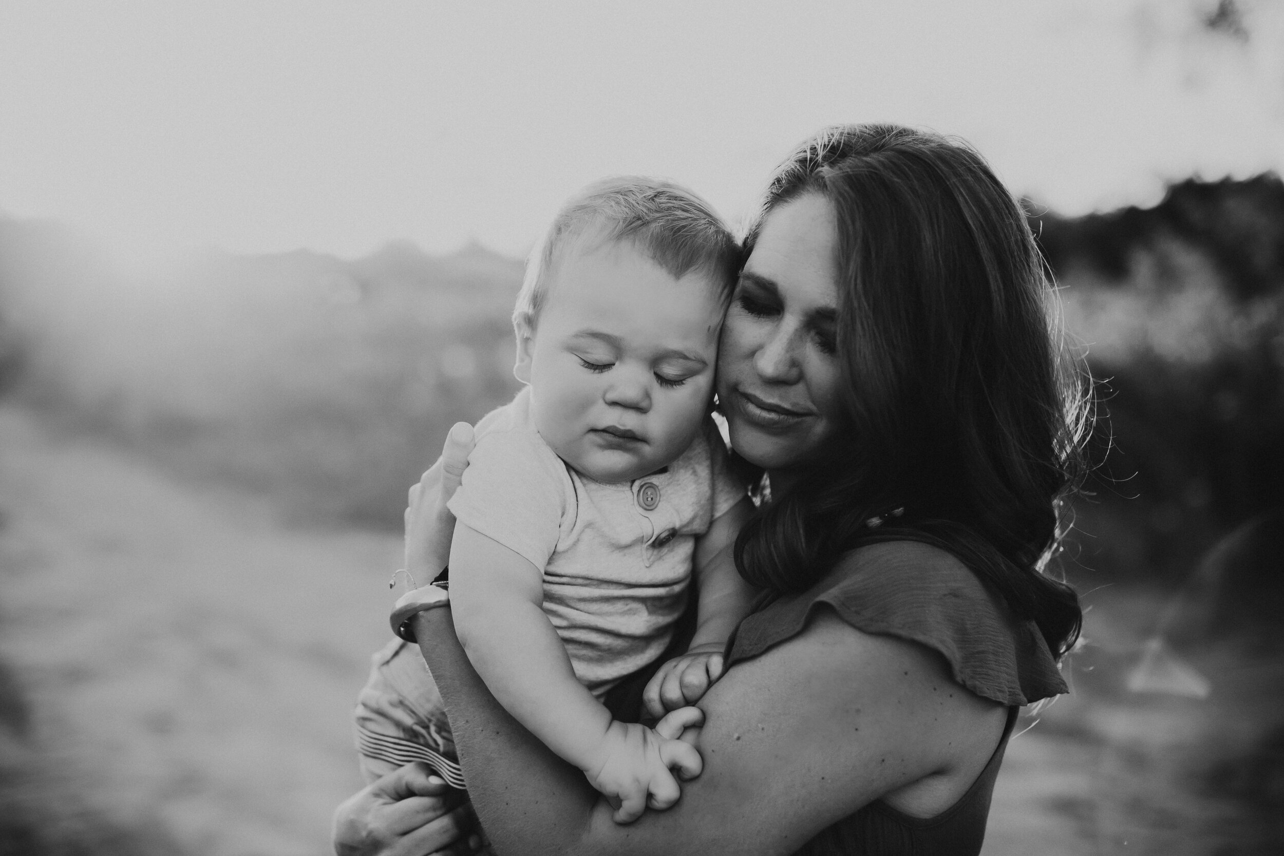 Black and white tender moment between mom and child #tealawardphotography #texasfamilyphotographer #amarillophotographer #amarillofamilyphotographer #lifestylephotography #emotionalphotography #familyphotoshoot #family #lovingsiblings #purejoy #familyphotos #naturalfamilyinteraction