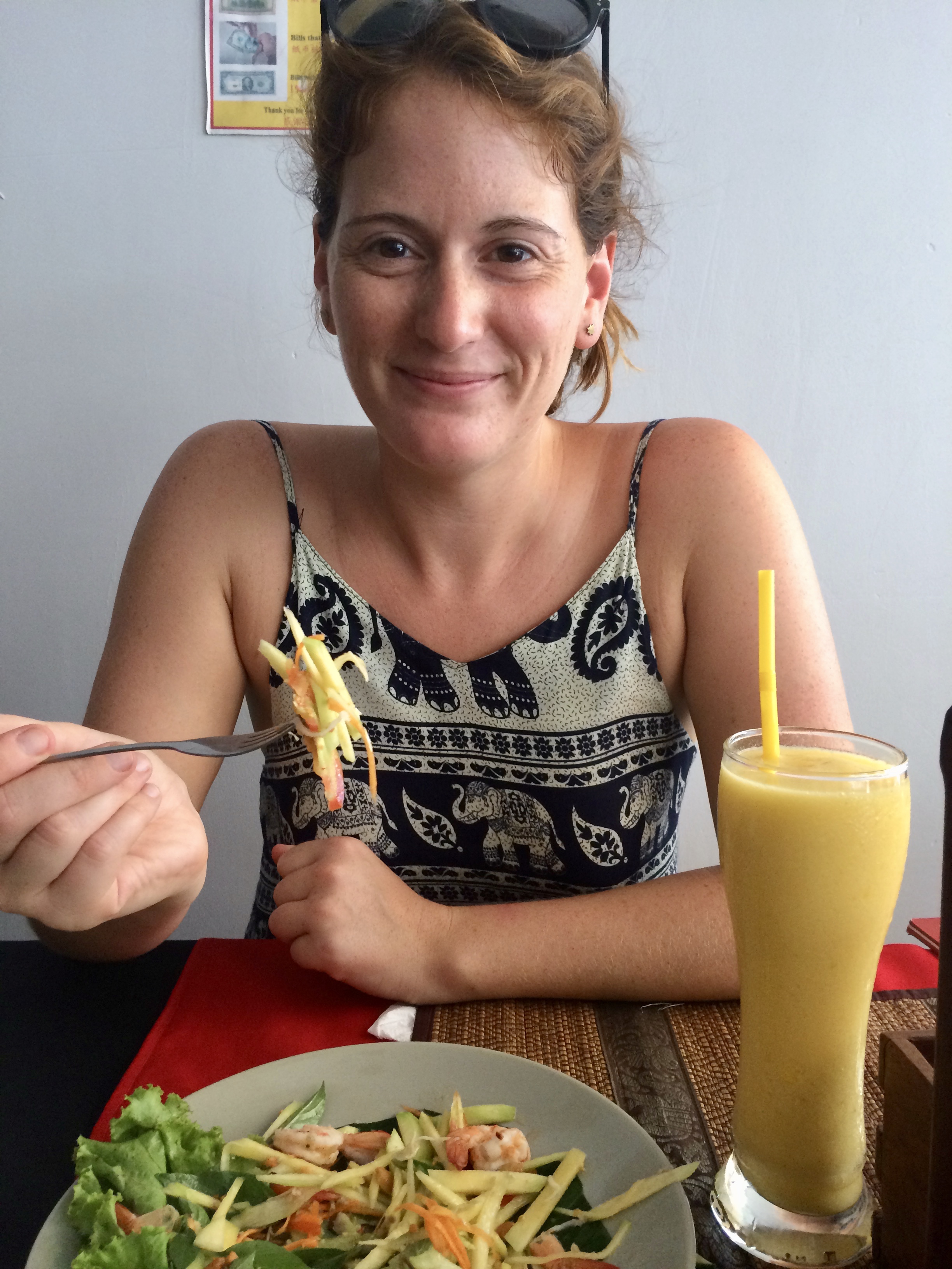 Lunch of fresh papaya salad and a mango smoothie in Siem Reap, Cambodia.