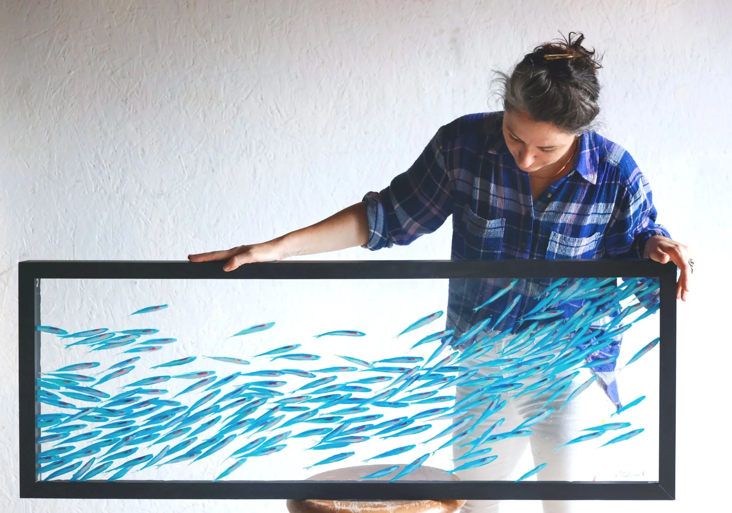 This original fish painting celebrates movement, light, and the quiet beauty of the underwater world. Painted with luminous layers of color, the piece captures the fluid rhythm of swimming fish — a meditation on flow and connection.

Framed in hardwo