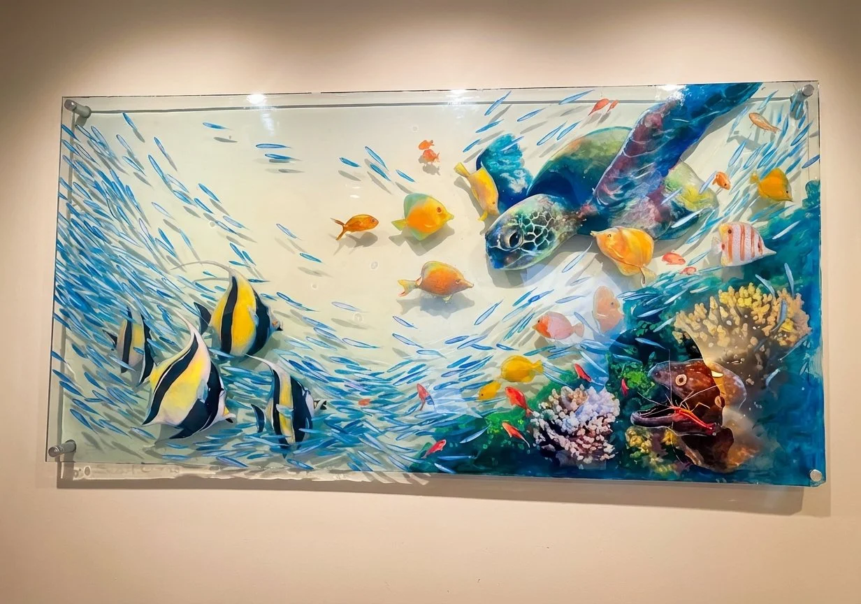 Colorful wall art of various tropical fish, a sea turtle, coral, and underwater plants.