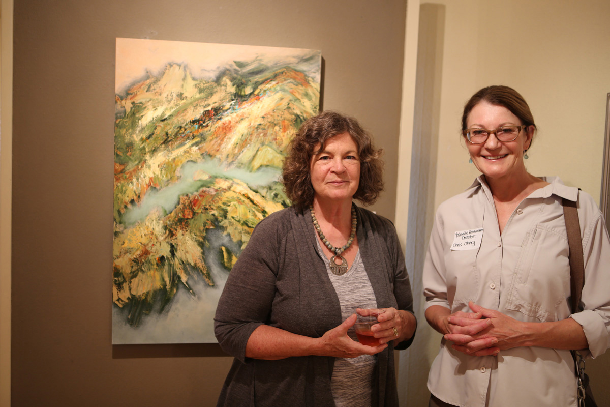 Janice Pluma, (left) and her acrylic painting, “Vista”. Christine Obers (right), Director, Yosemite Renaissance.
