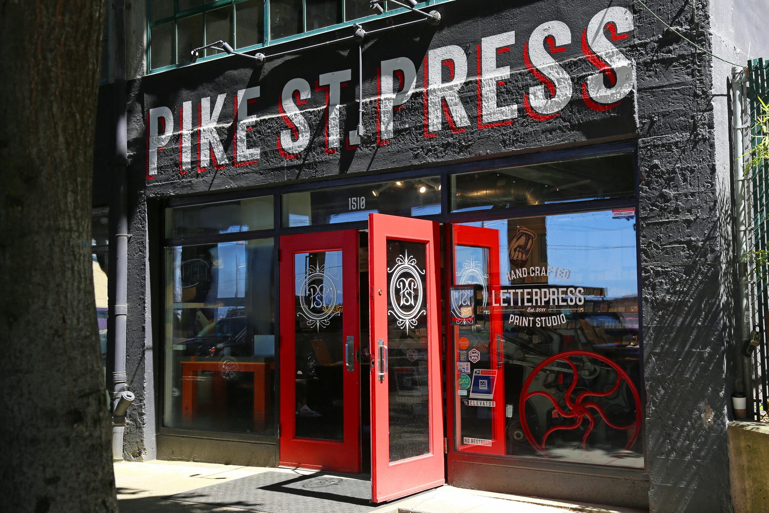 Pretty red doors at Pike Place Press.