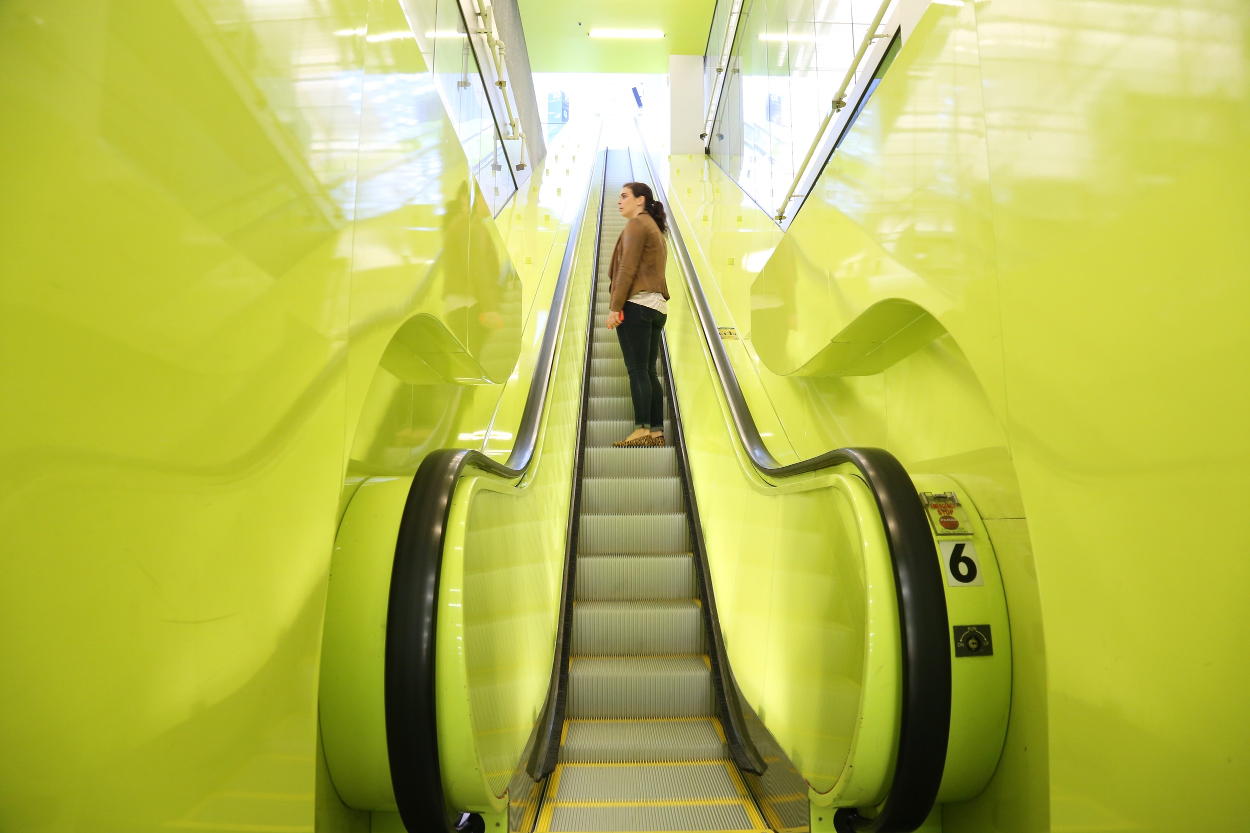 We love the neon yellow escalator.