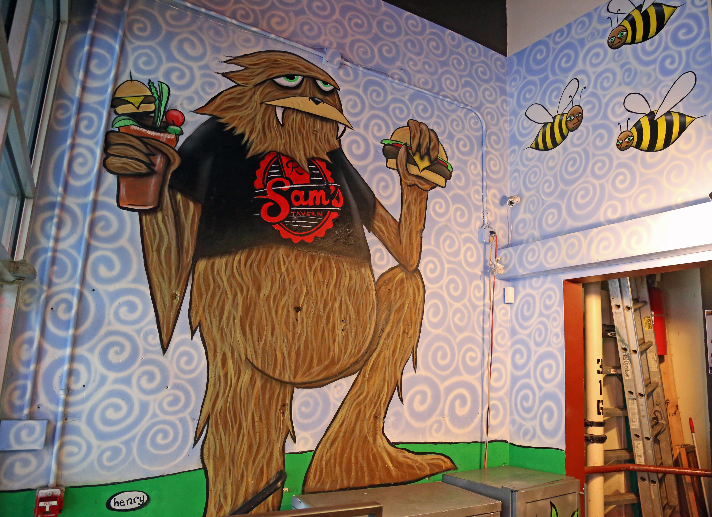 The Henry mural is hidden in the back of the bar!