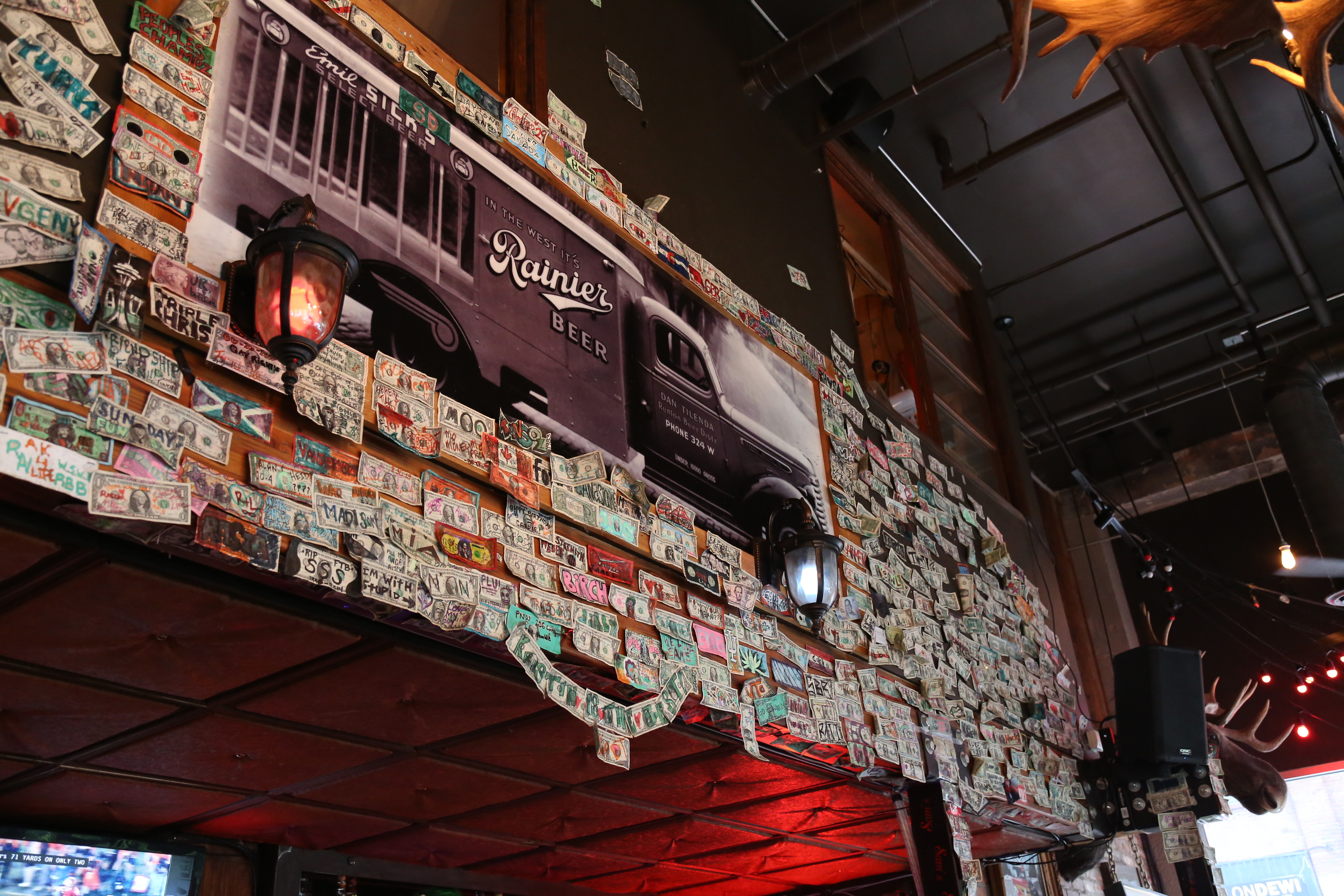 The sign of any good dive bar is dolla dolla bills as decorations.