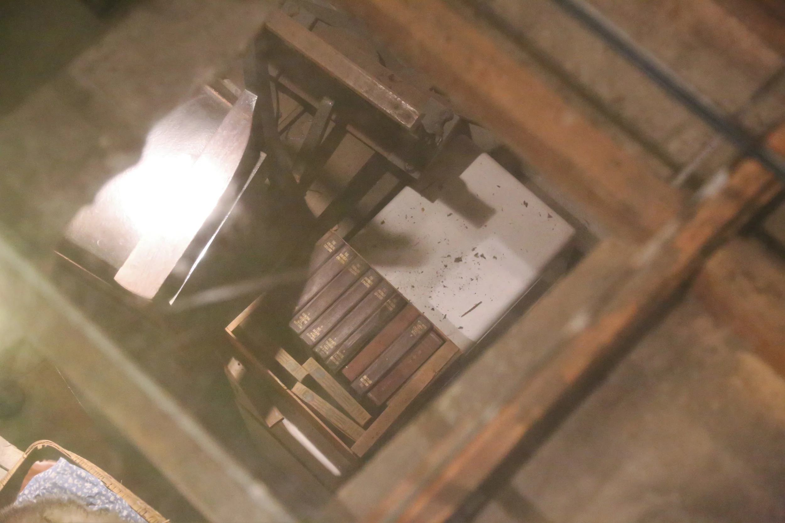 You can see the items left behind through a glass floor.