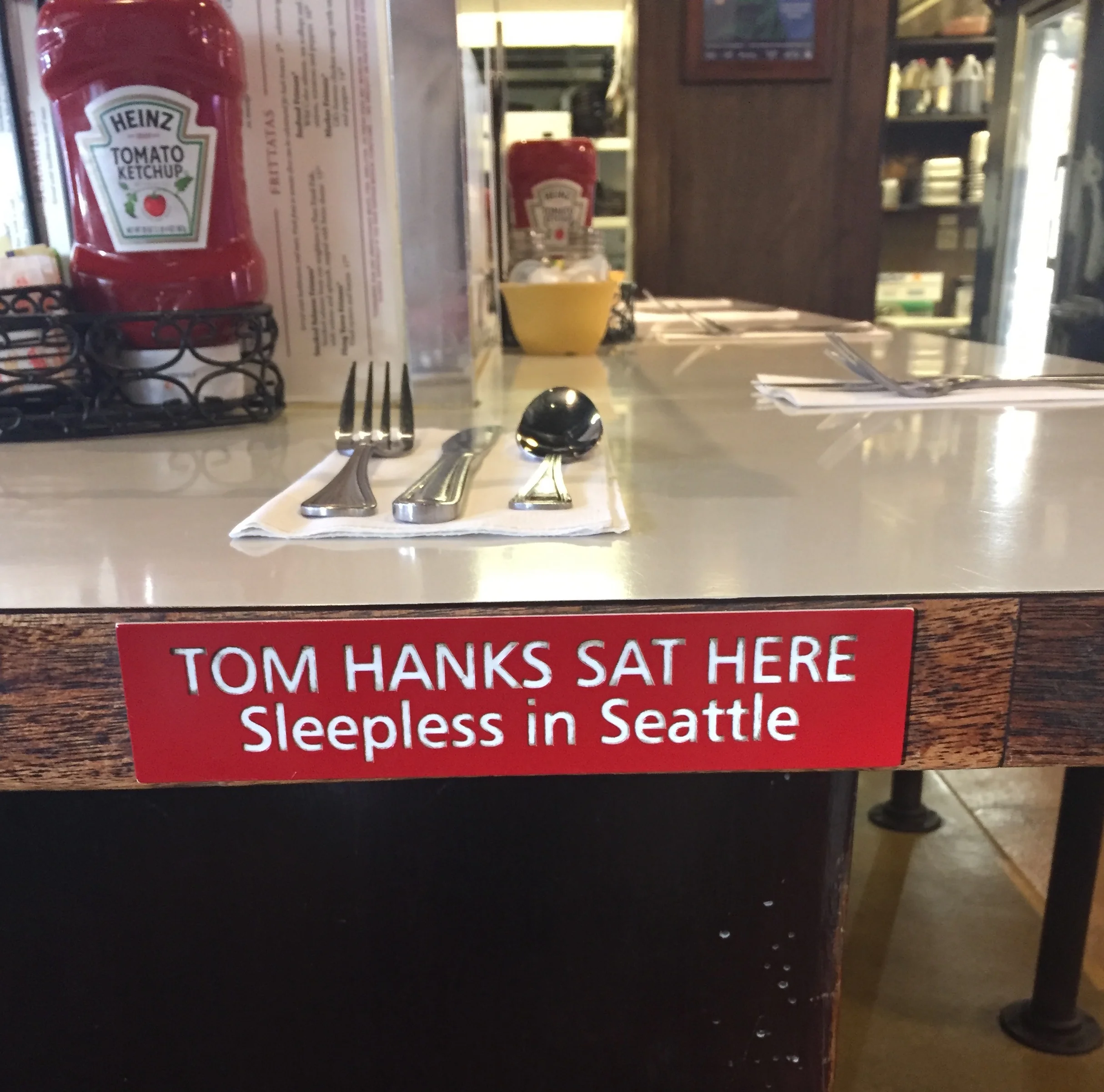 Sit your butt in the same stool that Tom Hanks sat in at The Athenian in Pike Place Market.
