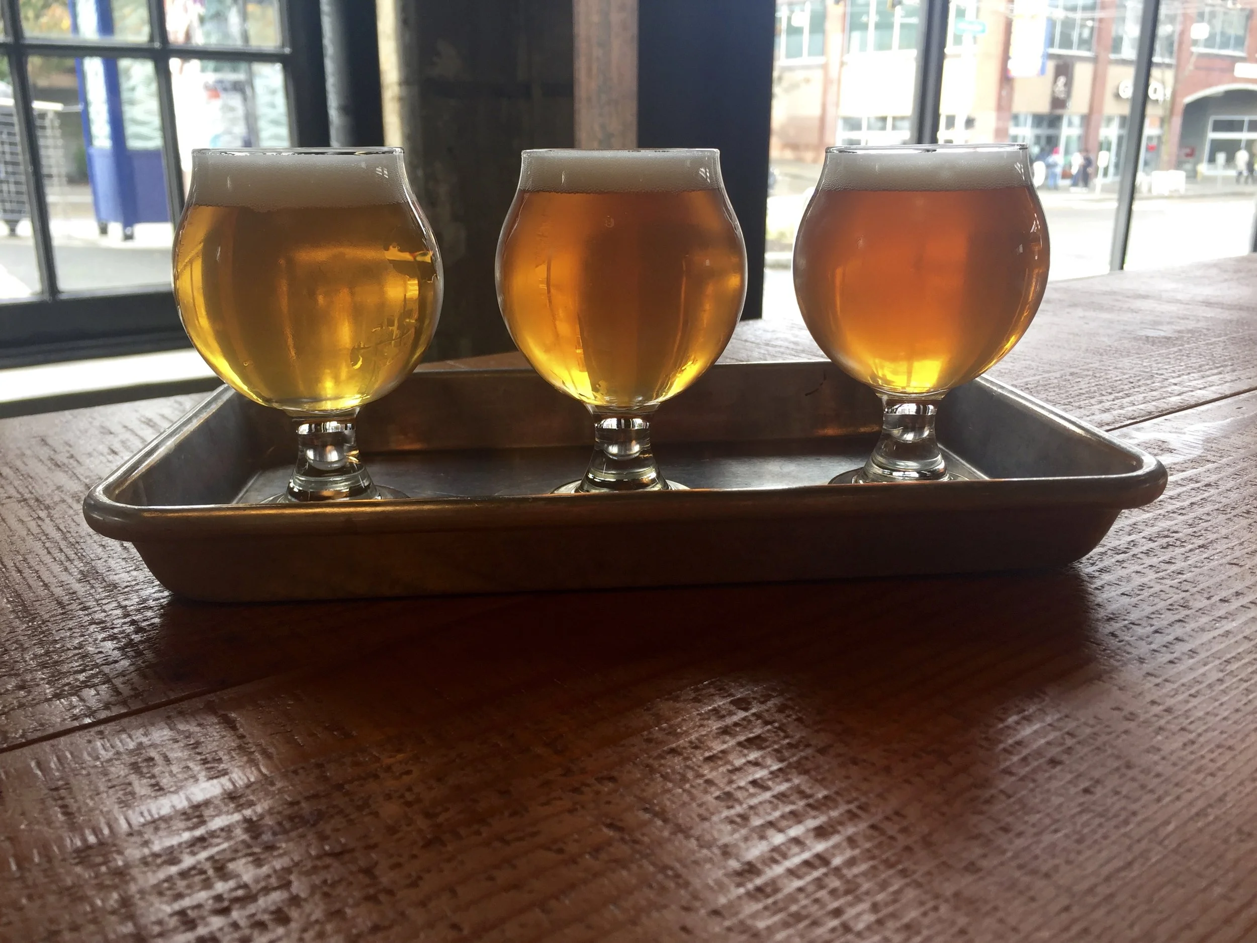 Sampler at Optimism Brewing