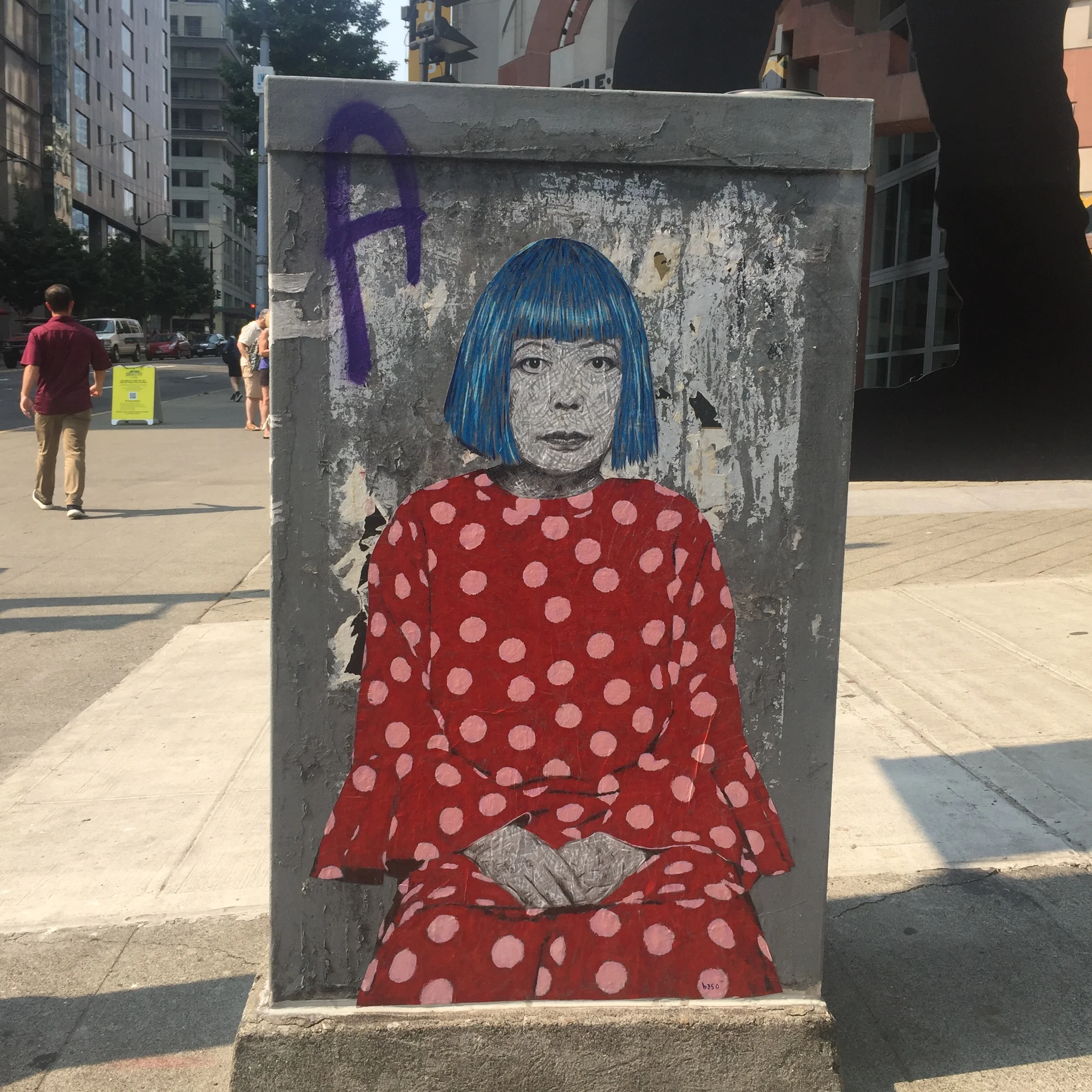 An image of the artist, Yayoi Kusama, painted outside of the SAM