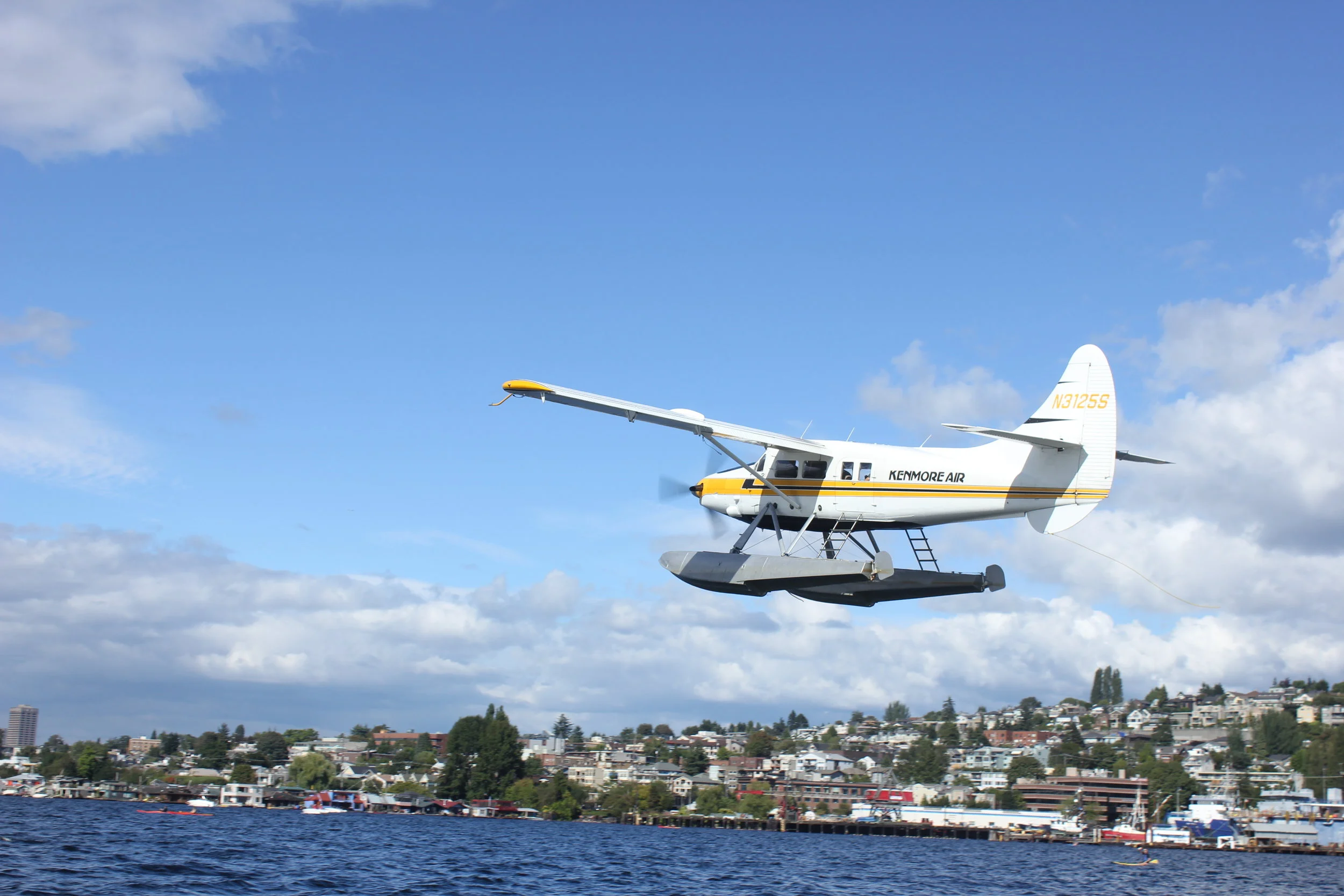 Kenmore Air seaplane comes in for a landing on Lake Union.
