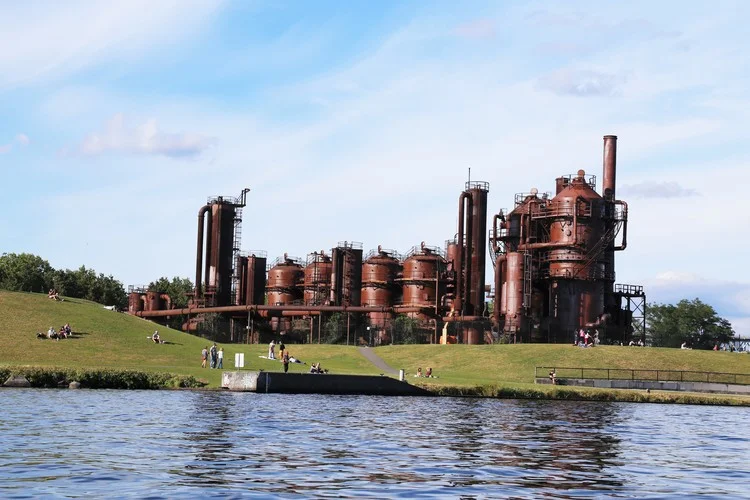 Gasworks Park in Seattle is one of the best lake front parks and people flock to it to fly kites, sun tan, and play games. The old gas plant gives it unique character too!