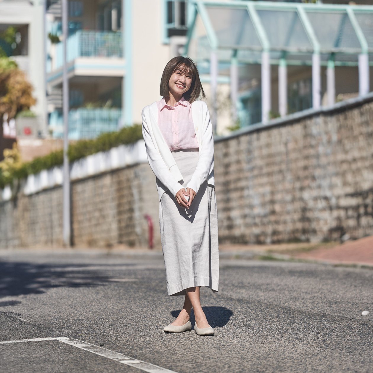 Photo by MUJI Hong Kong and Macao on March 11, 2024. May be an image of 1 person, suit, outerwear, slingback shoes, dress, turtleneck and street..jpg