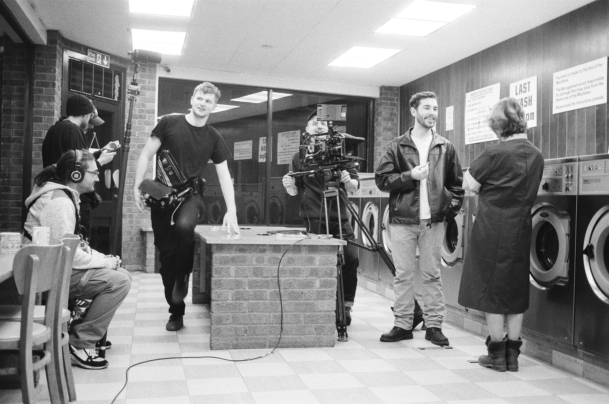 Smiles from cast and crew as they prepare for the next scene