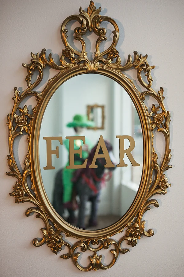 "Fear" Mirror, gold vinyl, spray paint 33" x 21"